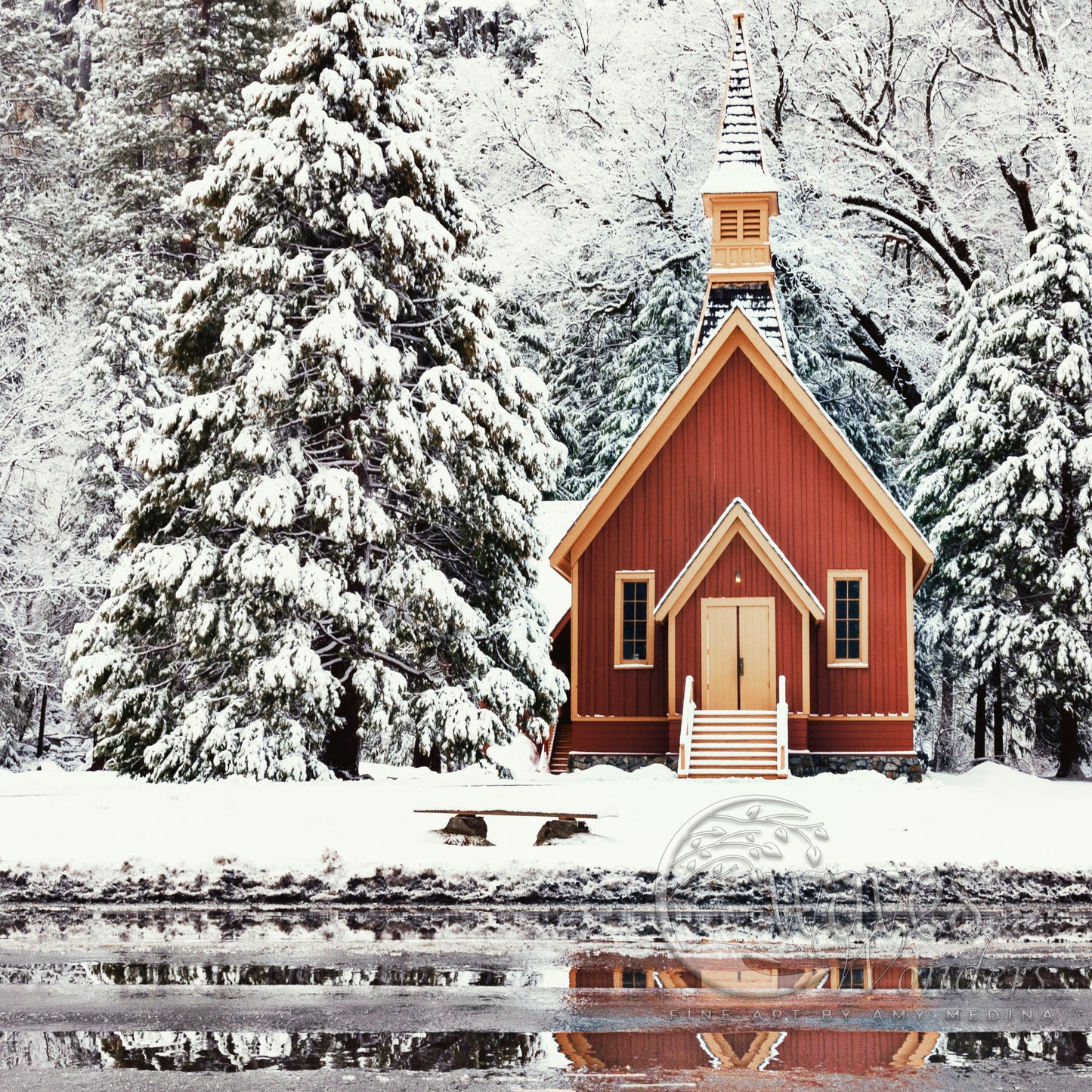 a red church with a steeple surrounded by snow