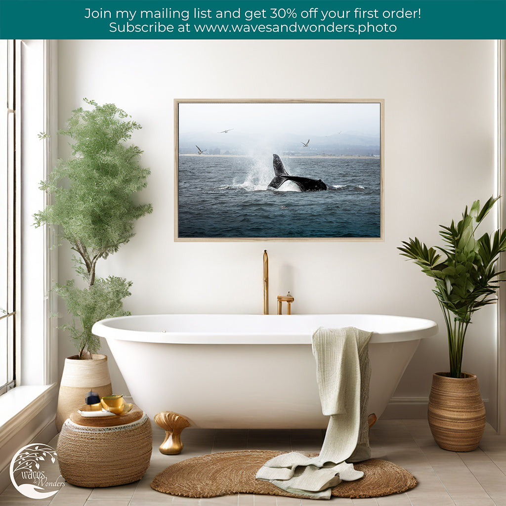 a bathroom with a tub and a picture of a whale