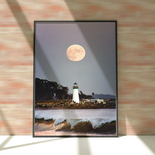 a picture of a lighthouse with a full moon in the background