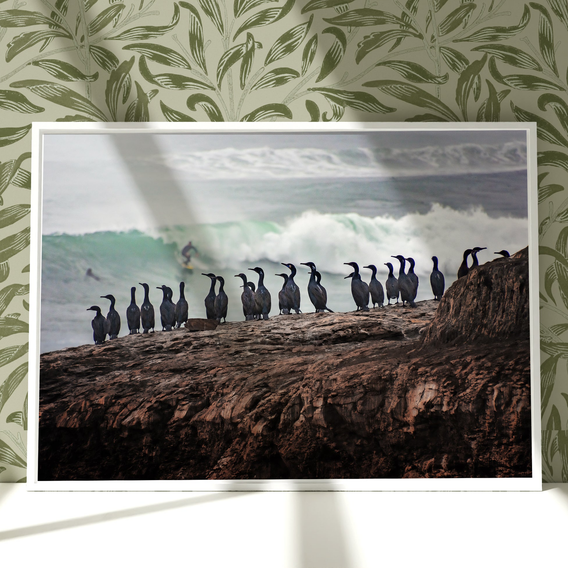 a picture of a group of penguins on a cliff