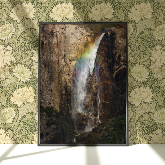 a picture of a waterfall with a rainbow in it