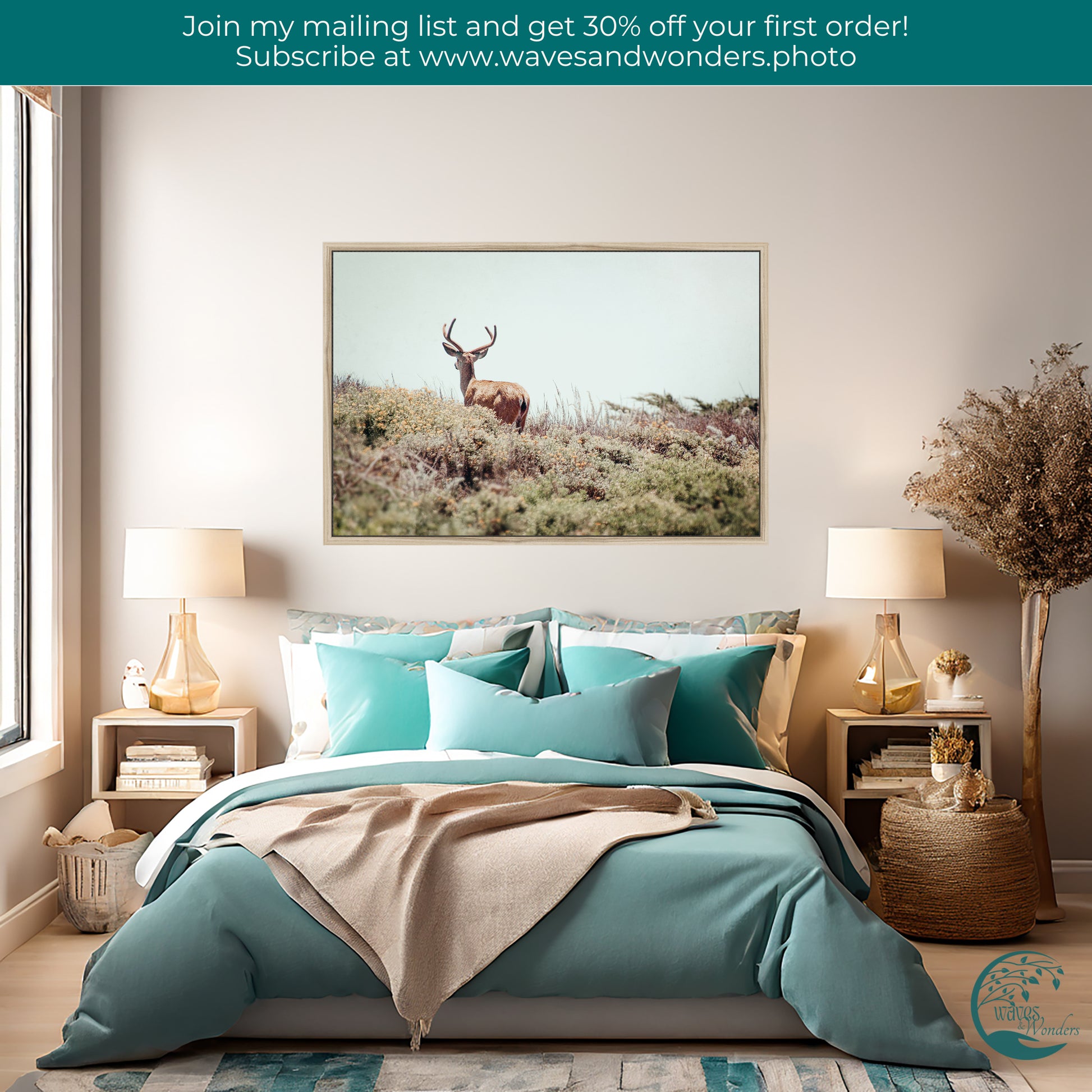 a bed with a blue comforter and a picture of a deer on the wall