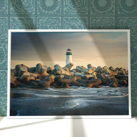 a picture of a lighthouse on a rock wall