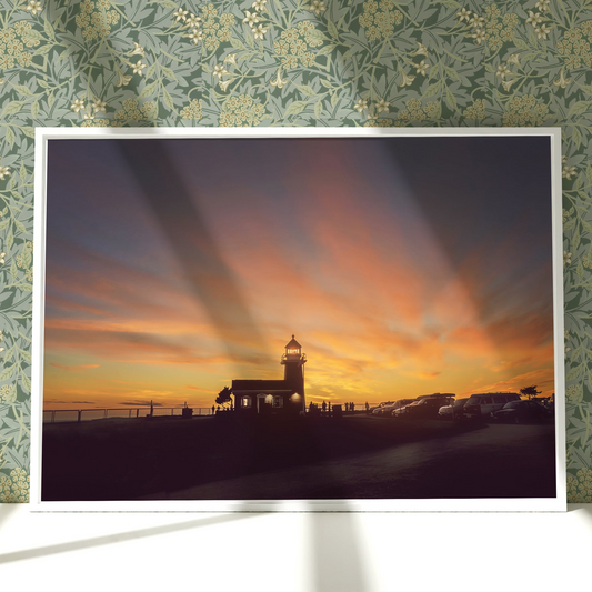 a picture of a lighthouse in the sunset