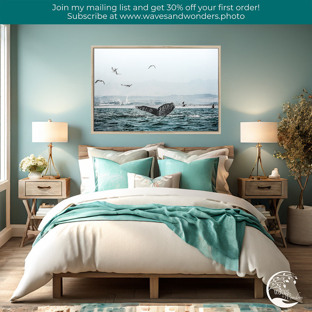 a bedroom with a picture of a whale on the wall