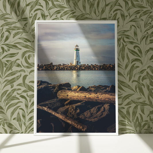 a picture of a light house in the water