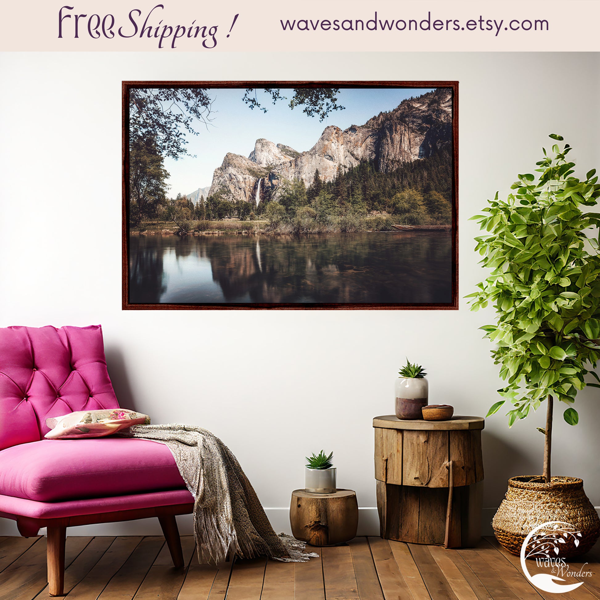 a pink chair sitting in front of a picture of mountains