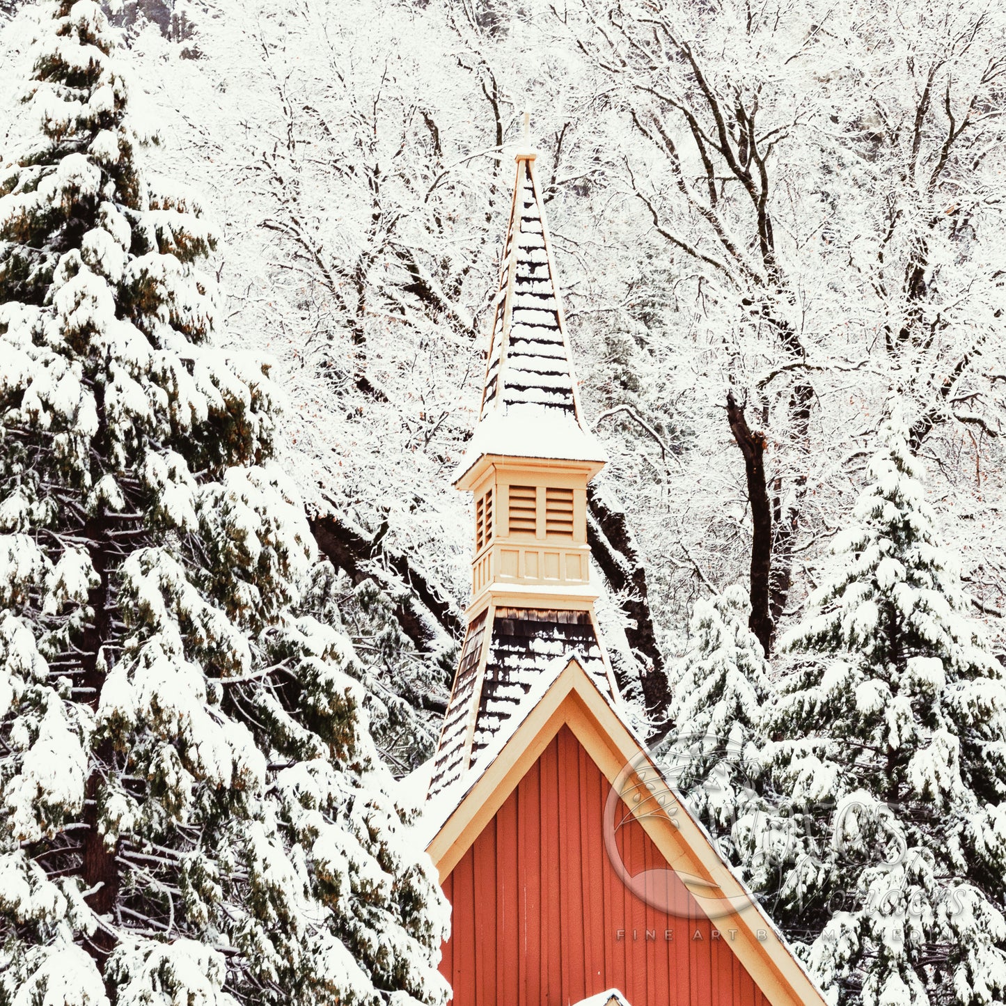 a red church with a steeple covered in snow