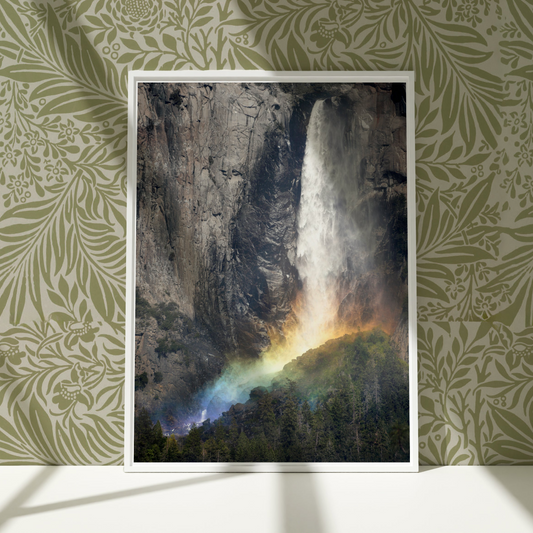 a picture of a waterfall with a rainbow coming out of it