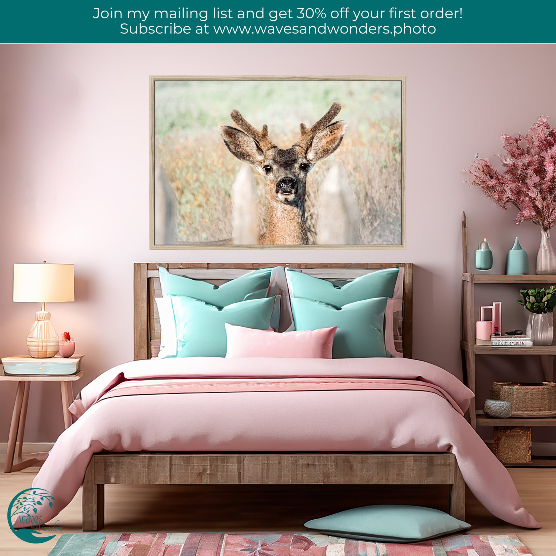 a picture of a deer on a wall above a bed