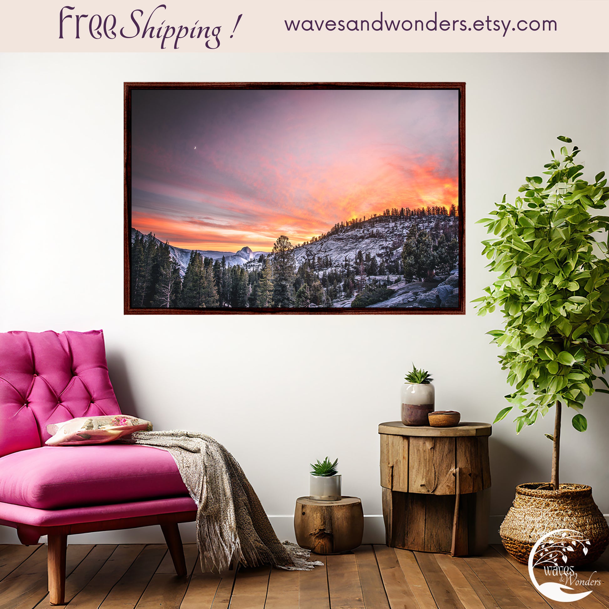 a pink chair sitting in front of a picture of a mountain