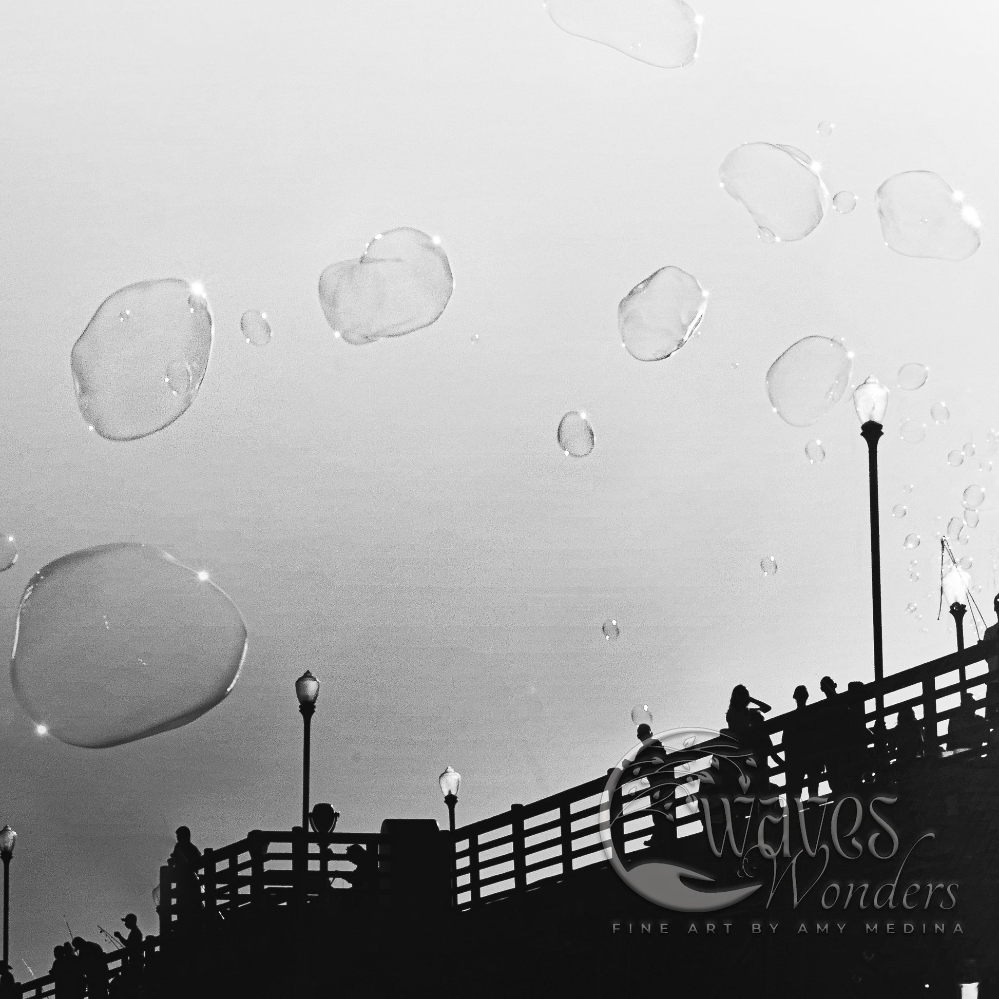 a black and white photo of bubbles floating in the air