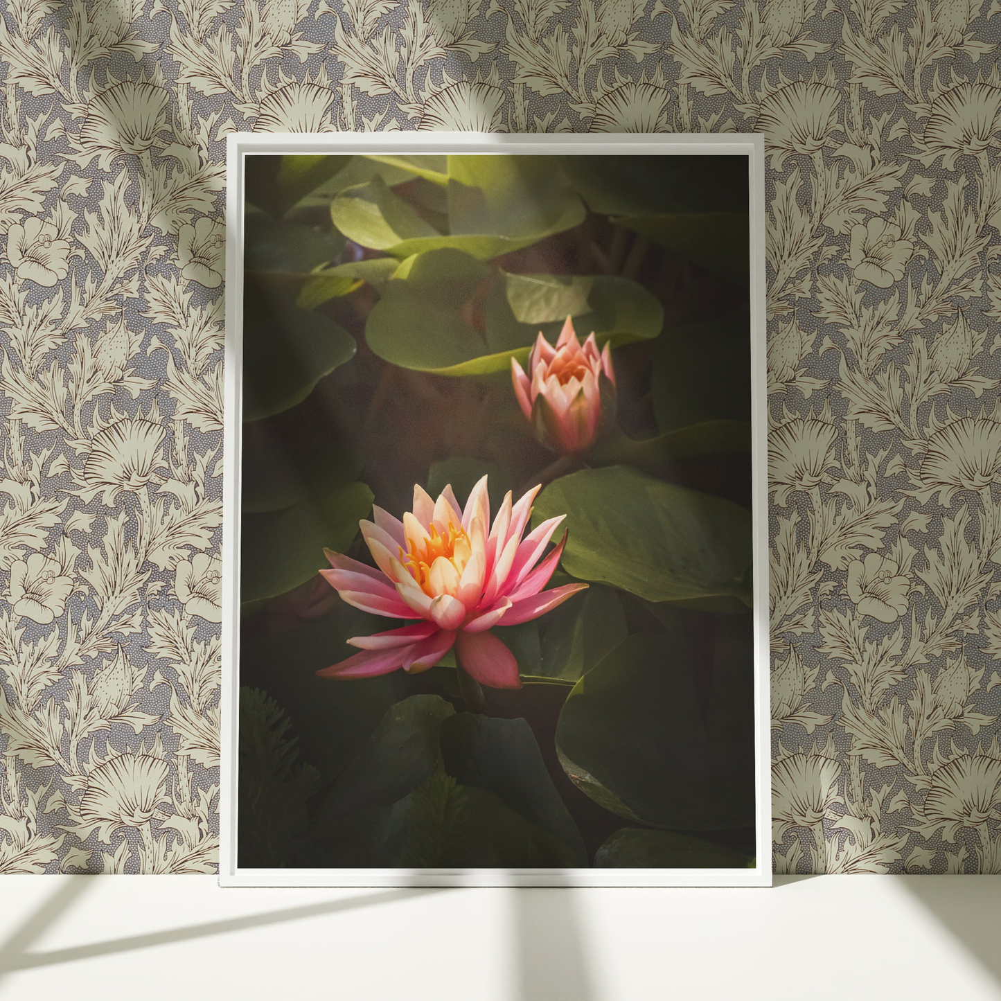 a picture of two water lilies on a wall
