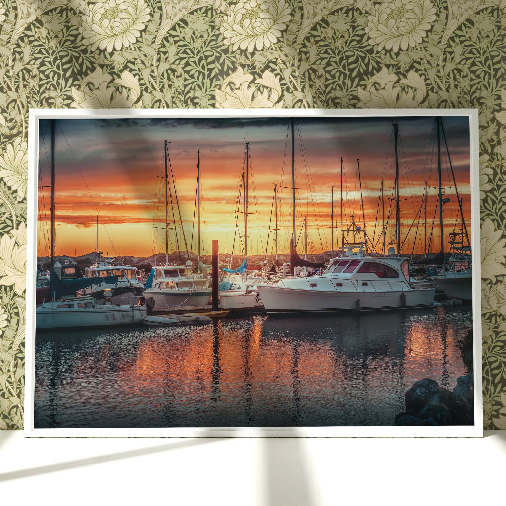 a picture of boats in a harbor at sunset