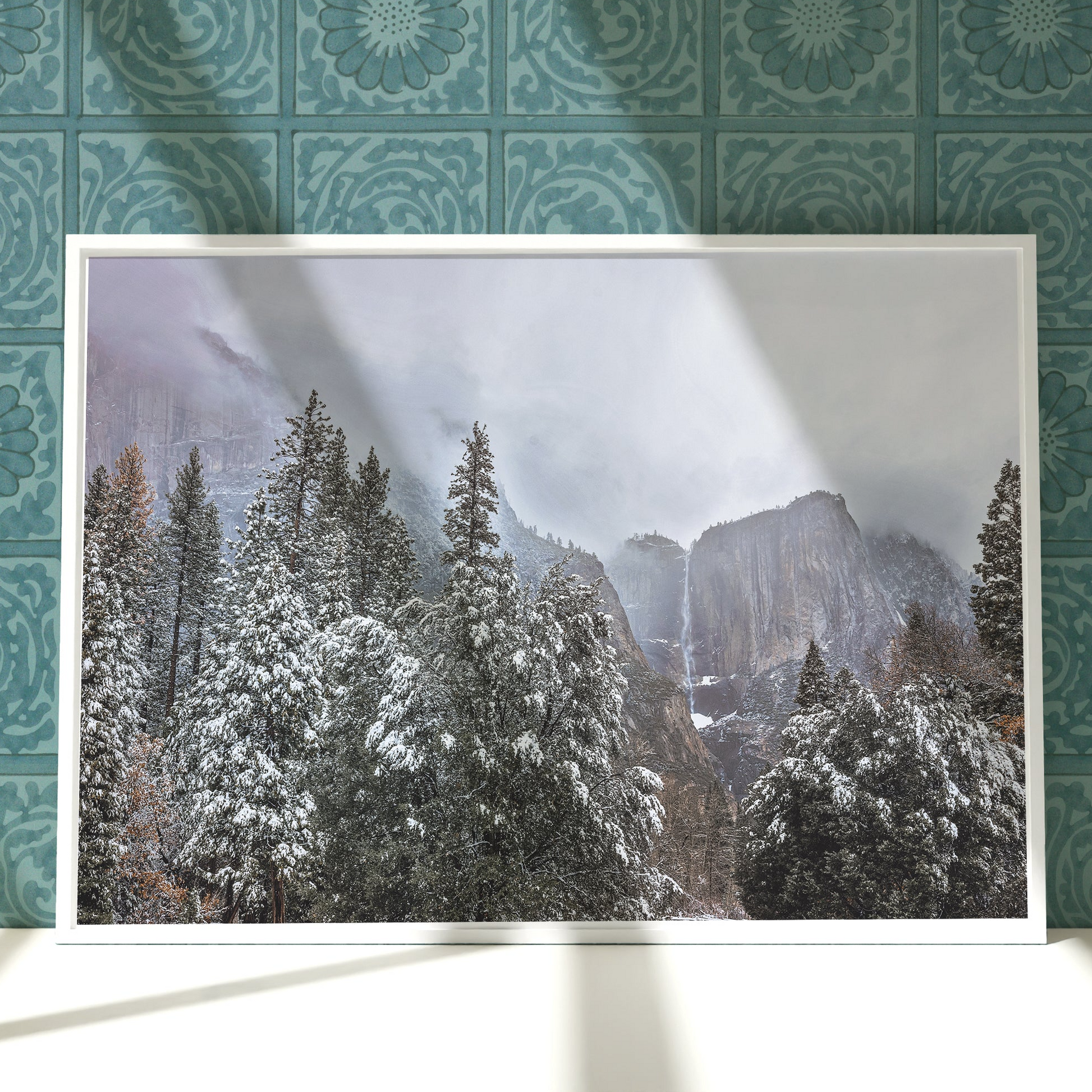 a picture of a snowy mountain with trees in the foreground
