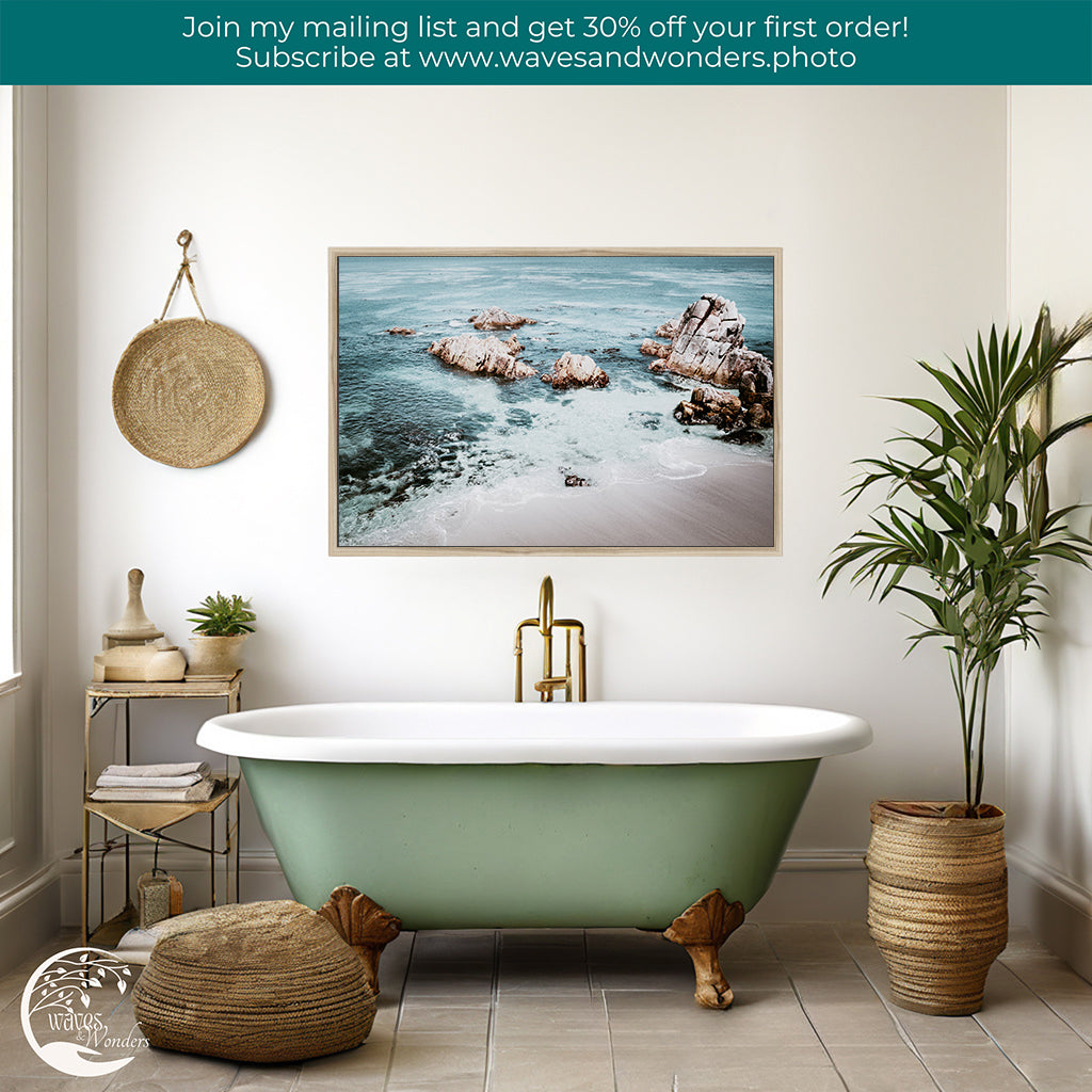 a bathroom with a claw foot tub and a painting on the wall