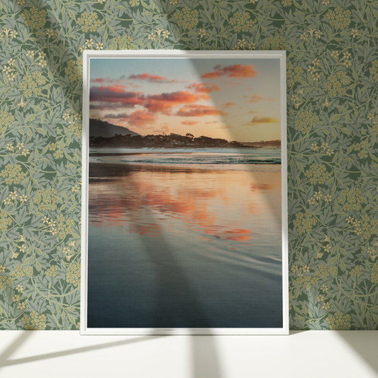 a picture of a sunset over a beach