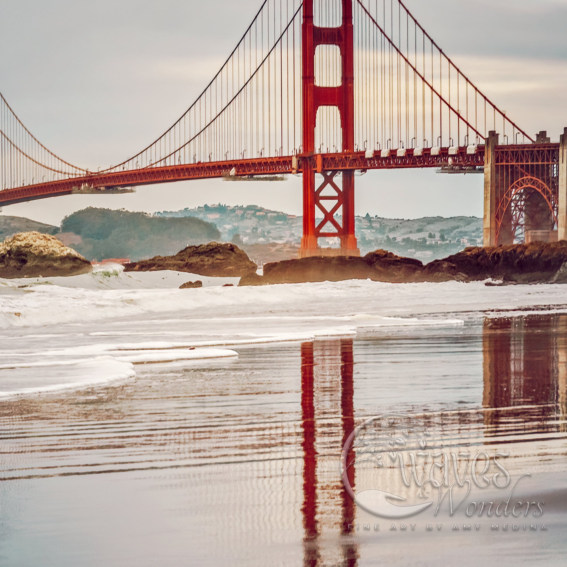 the golden gate bridge is reflected in the water