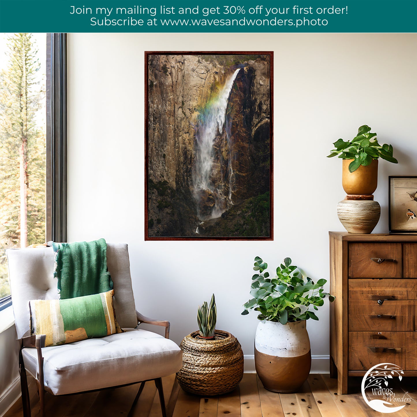a living room with a painting of a waterfall