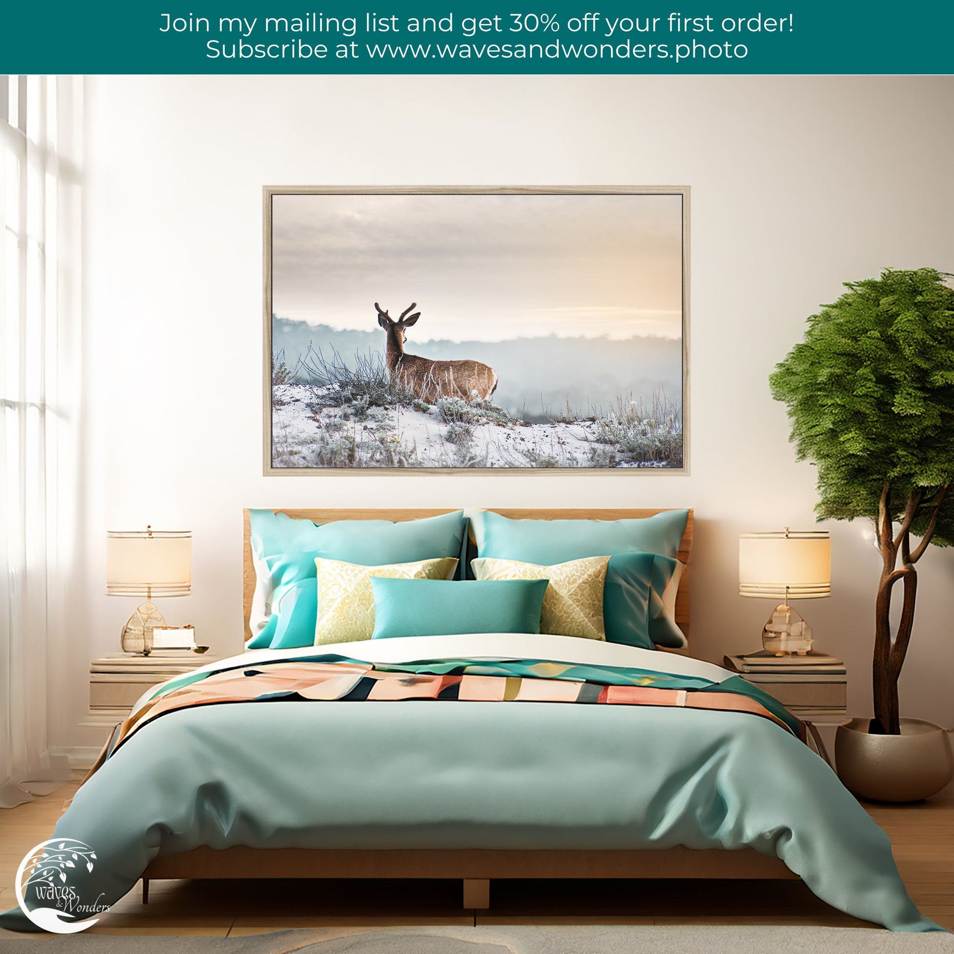 a picture of a deer on a wall above a bed