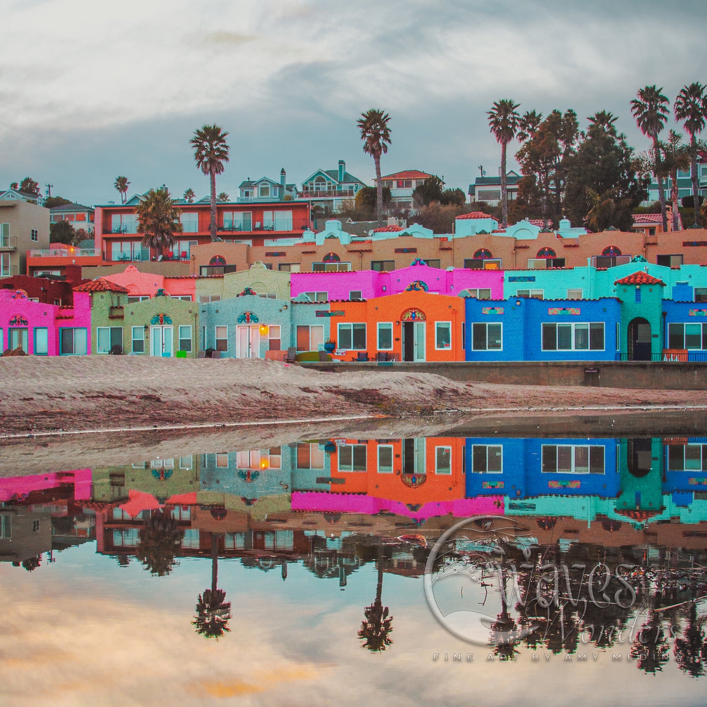 a row of colorful houses reflecting in a body of water