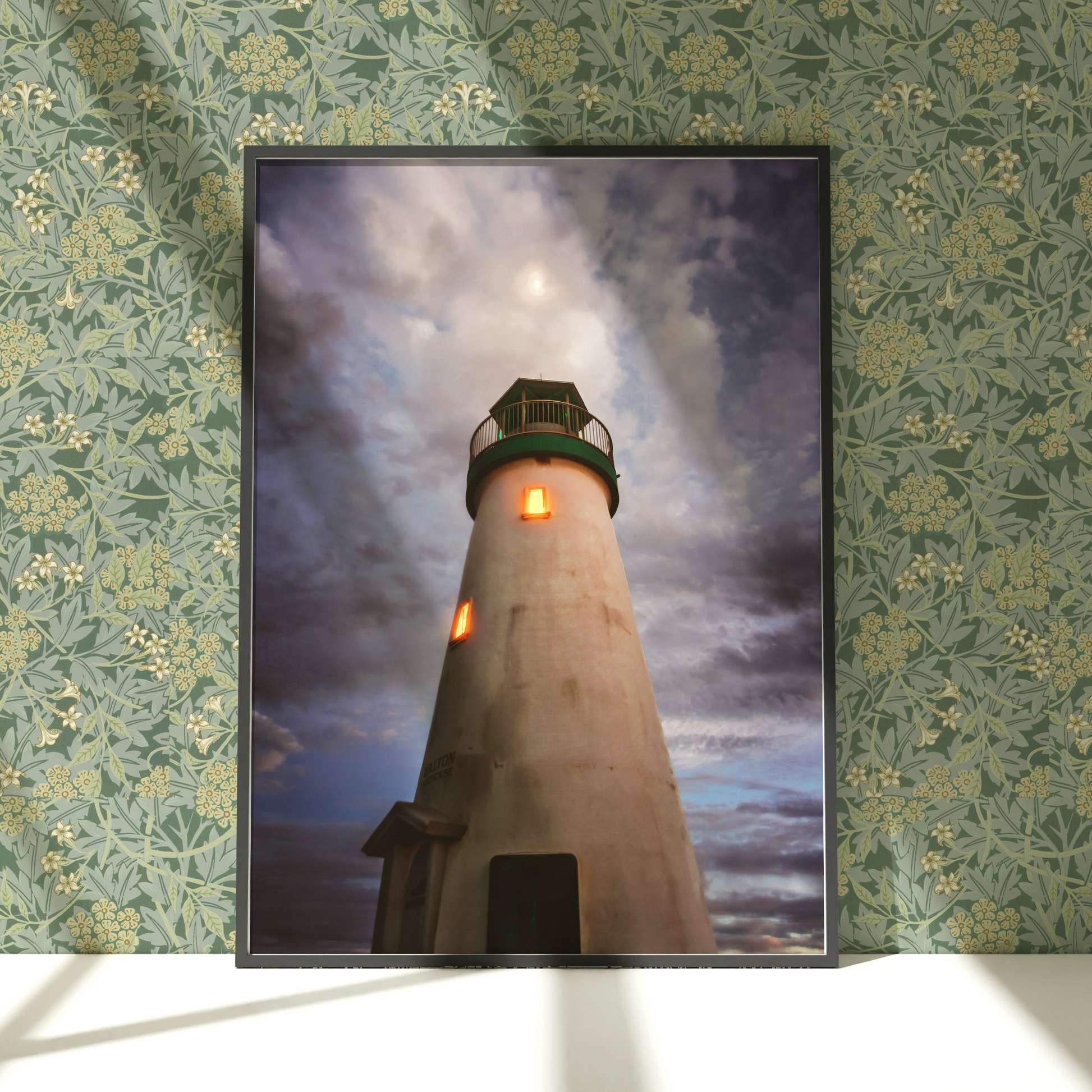 a picture of a lighthouse on a wall