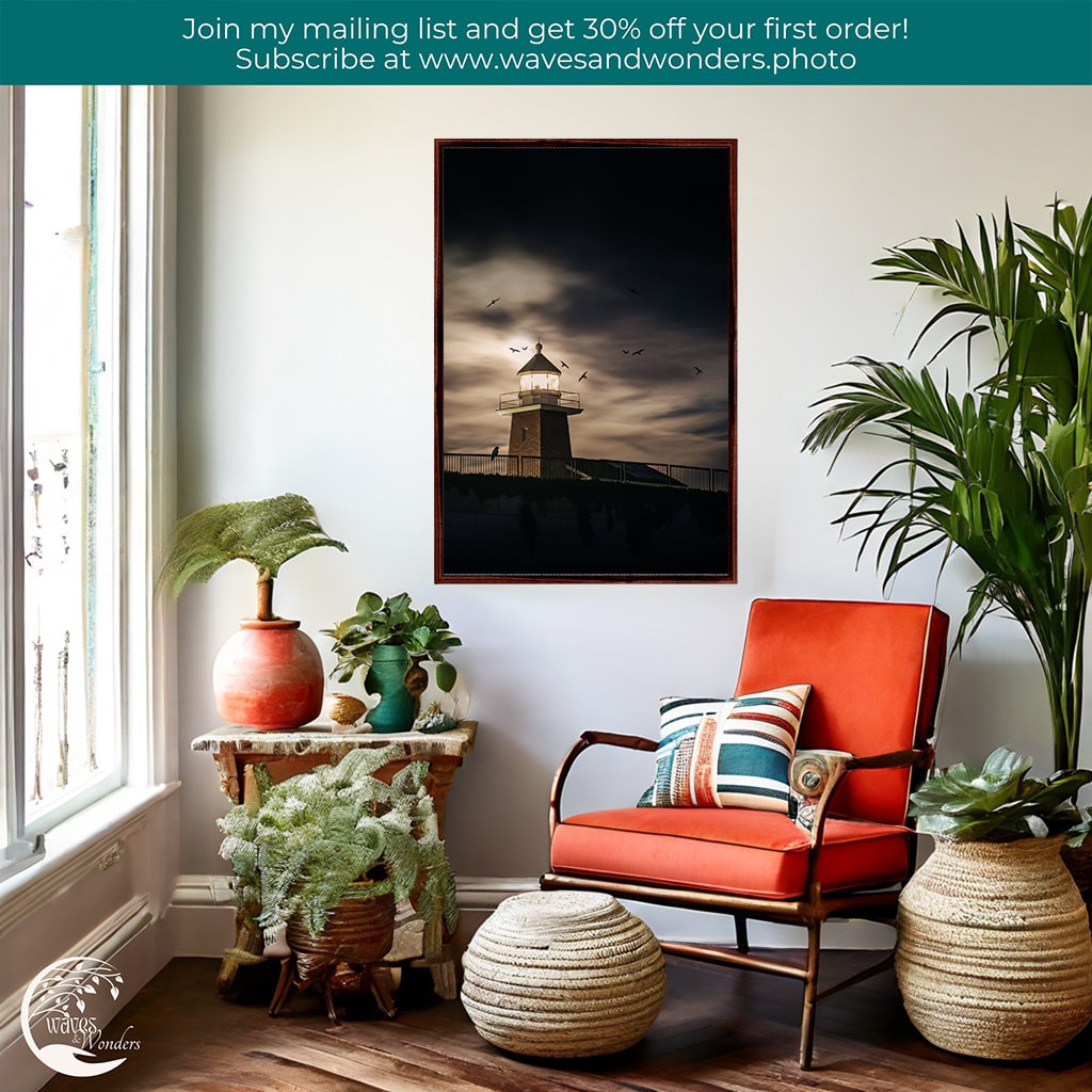 a room with a chair, potted plants, and a picture on the wall