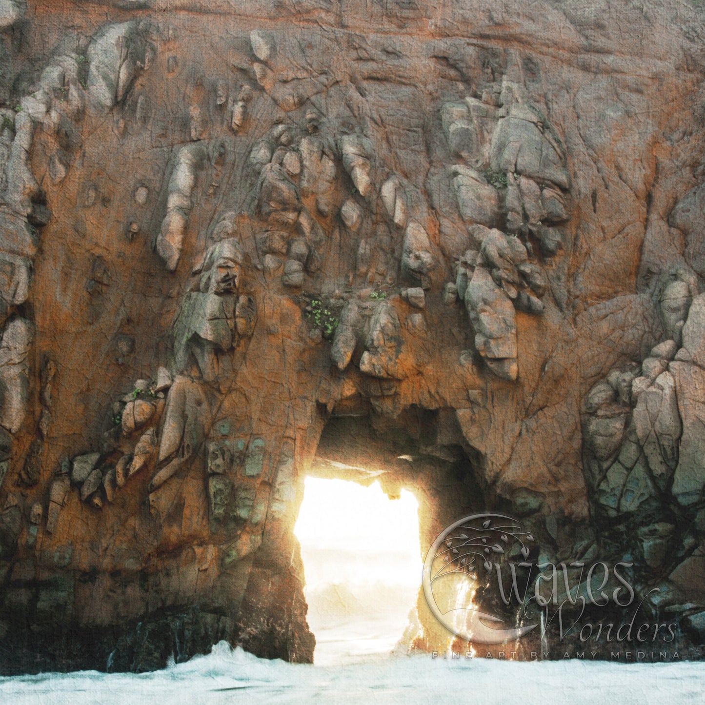 a large rock formation with a light at the end of it