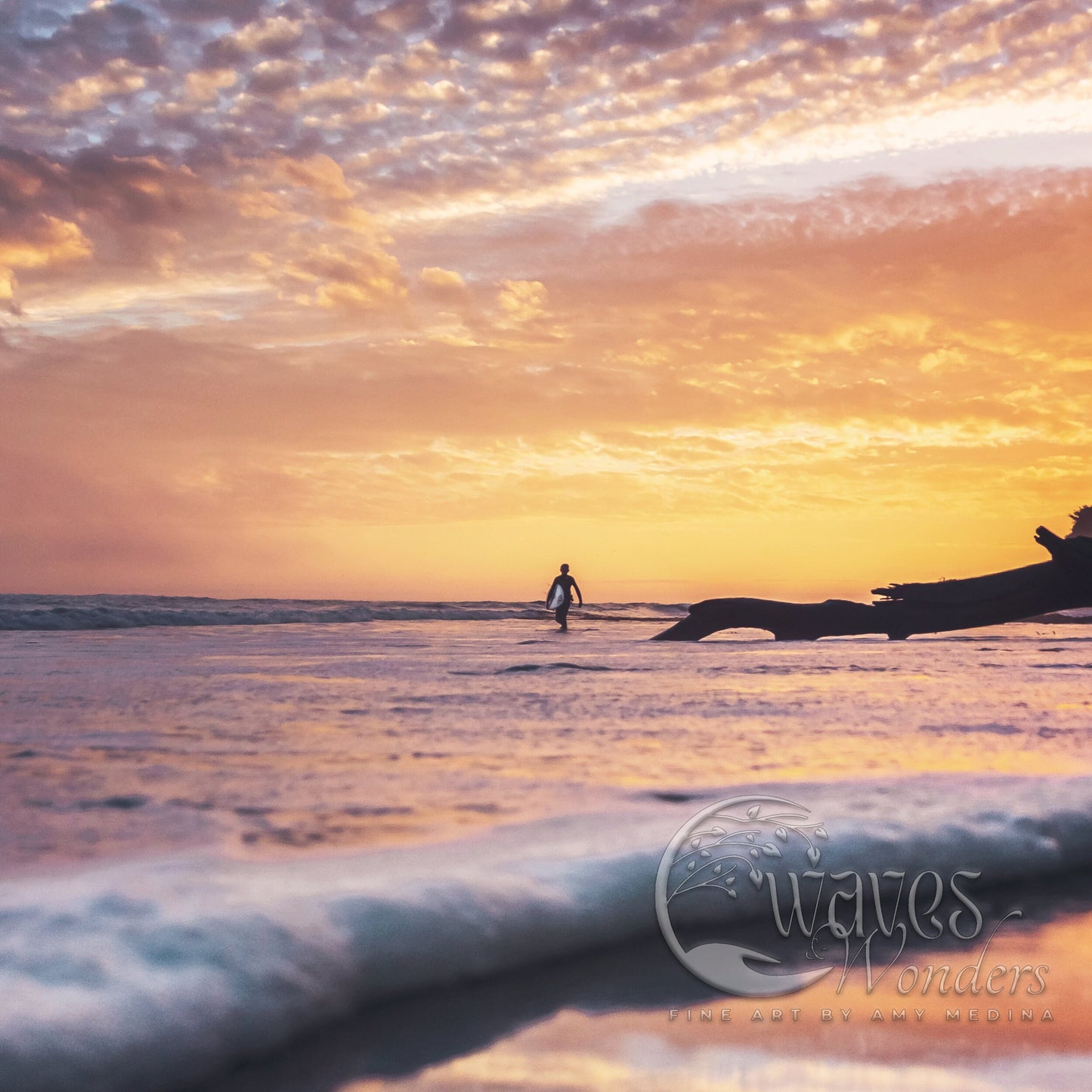 a person standing on a surfboard in the ocean at sunset