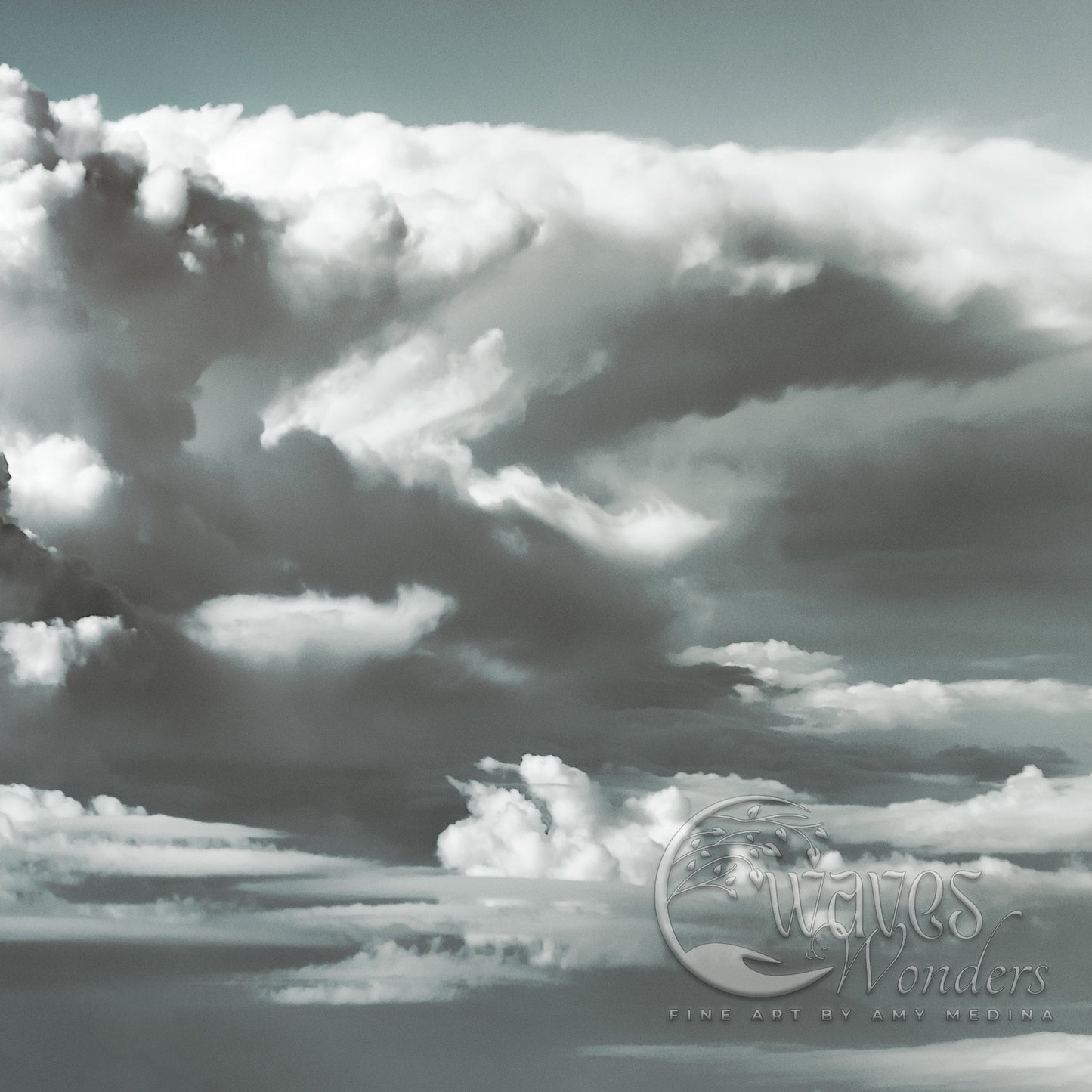 a black and white photo of clouds in the sky