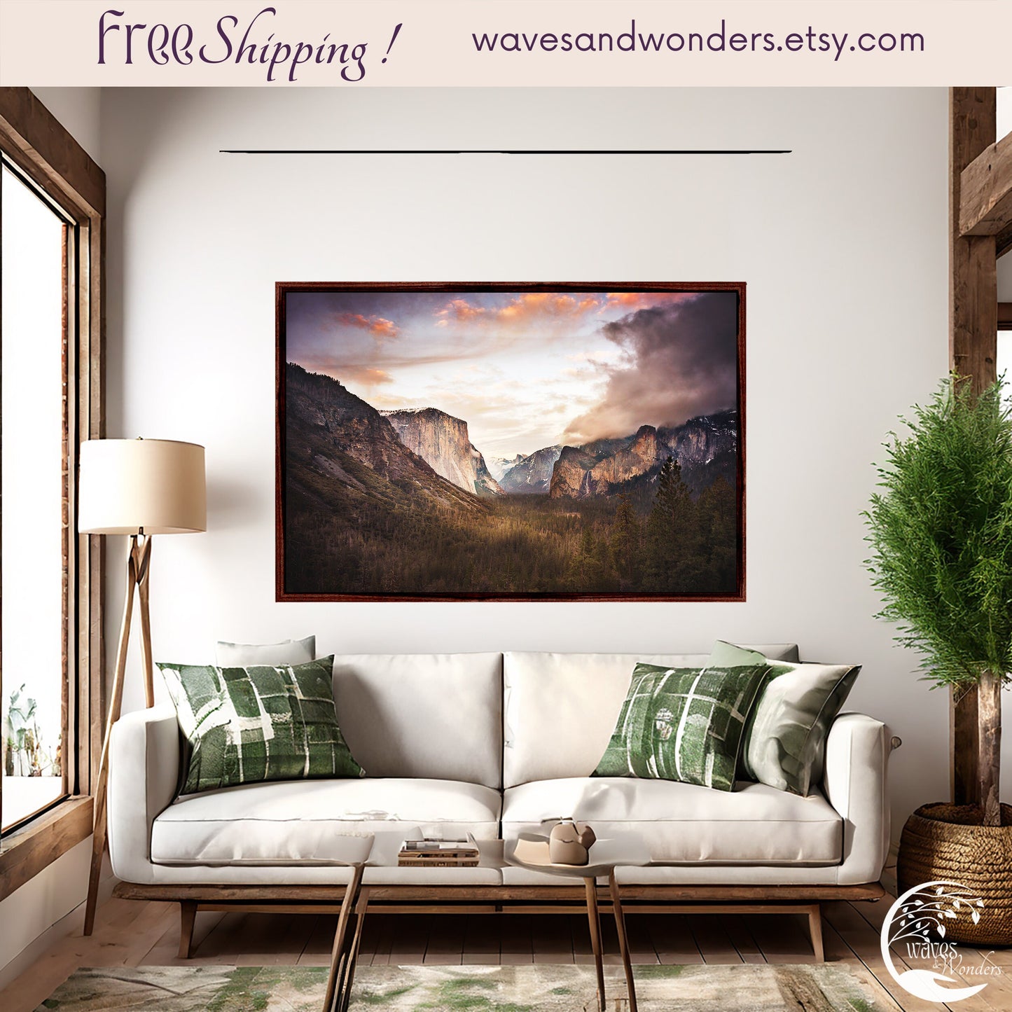 a living room with a white couch and a painting on the wall