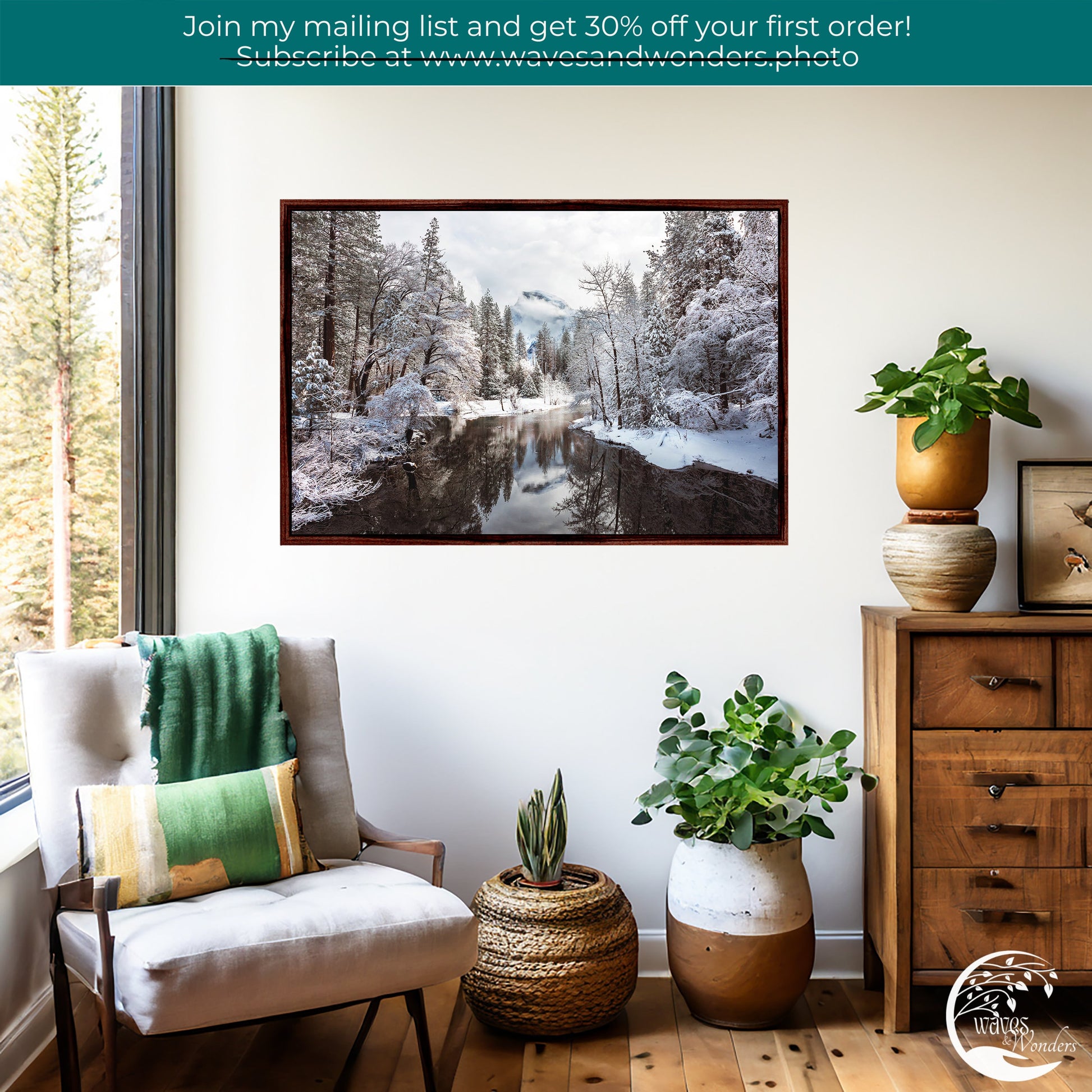 a living room with a chair and a painting on the wall