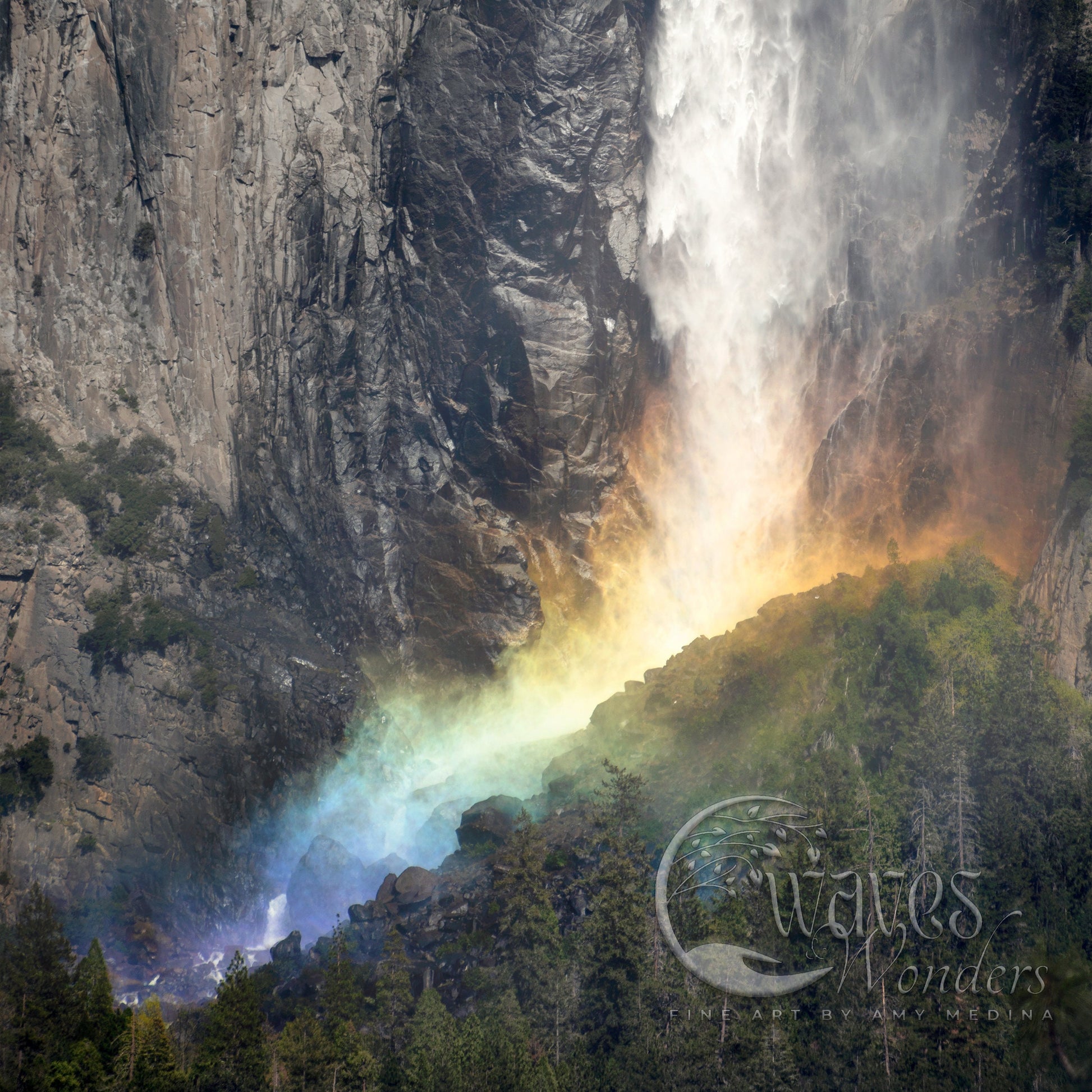 a waterfall with a rainbow in the middle of it