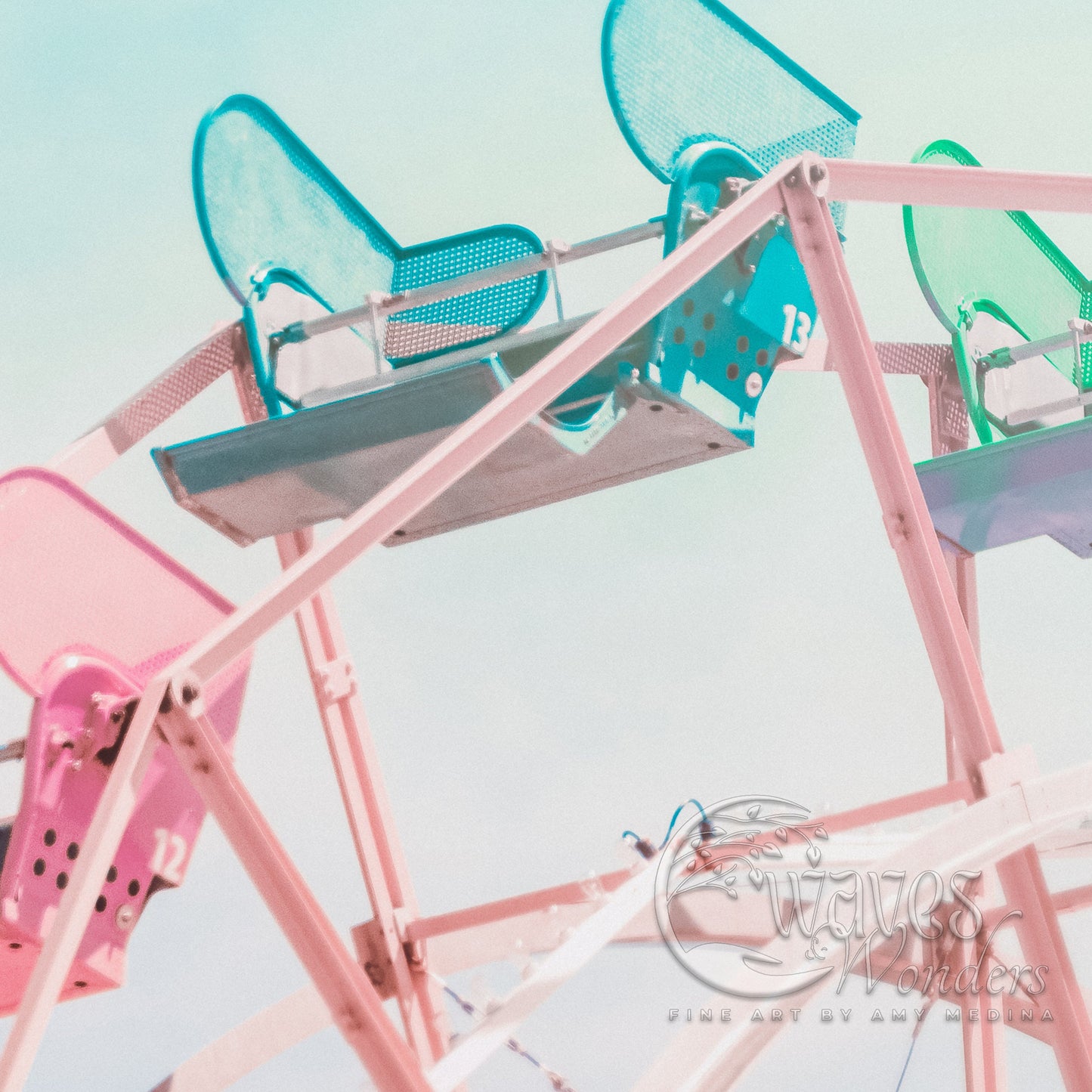 a close up of a ferris wheel with a sky background