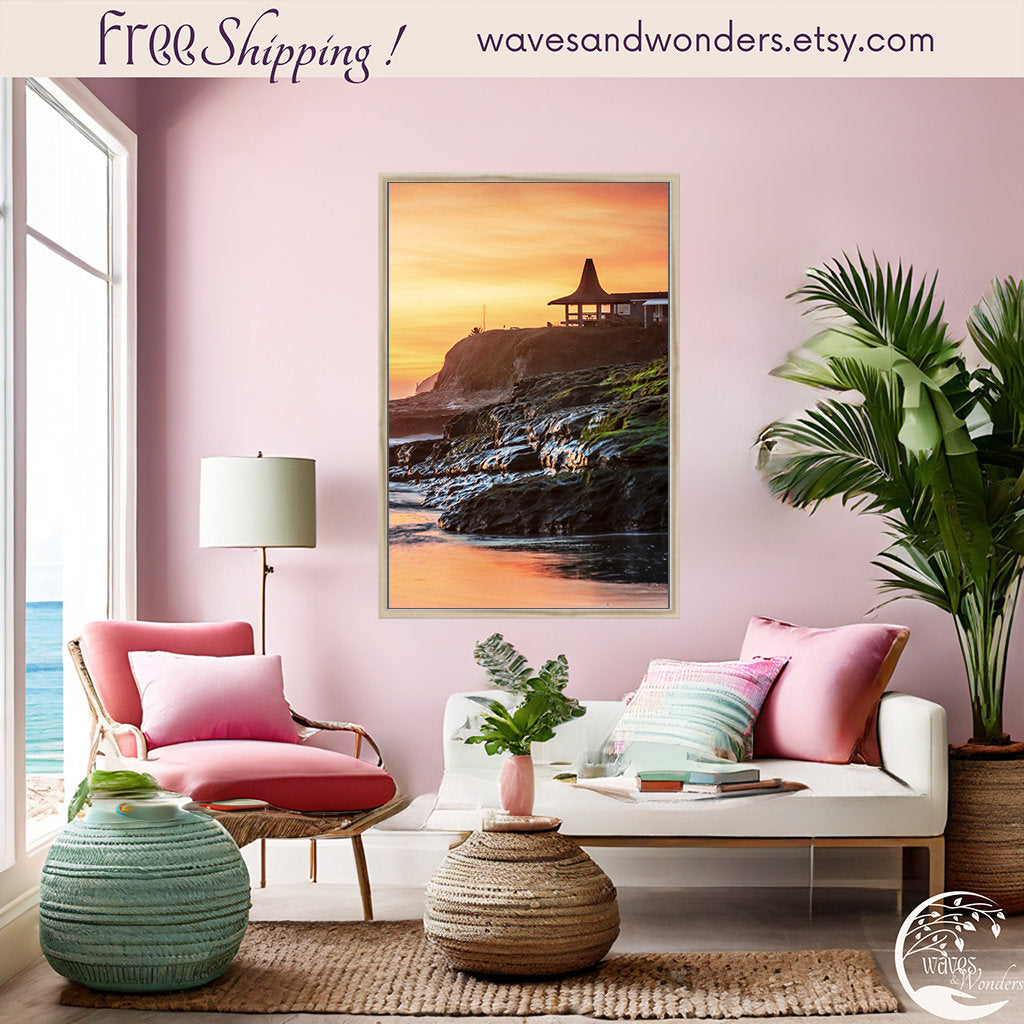 a living room with pink walls and a painting on the wall