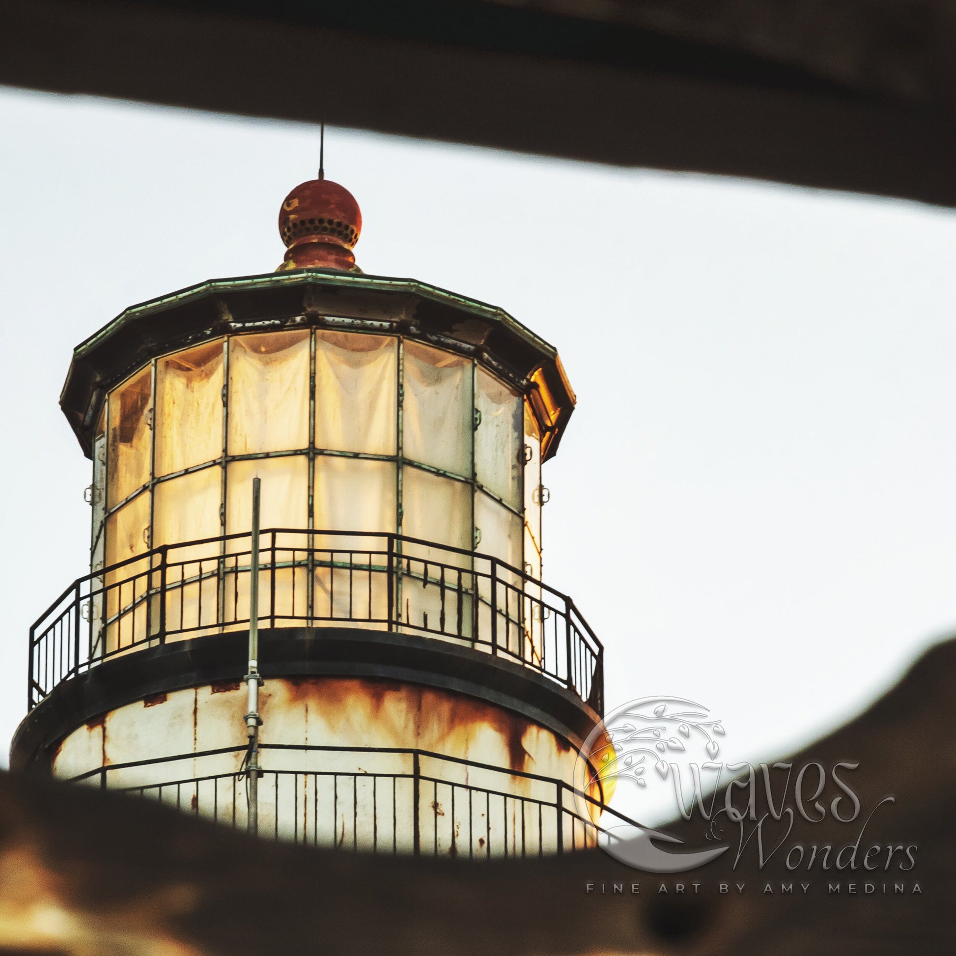 a large light house sitting on top of a hill