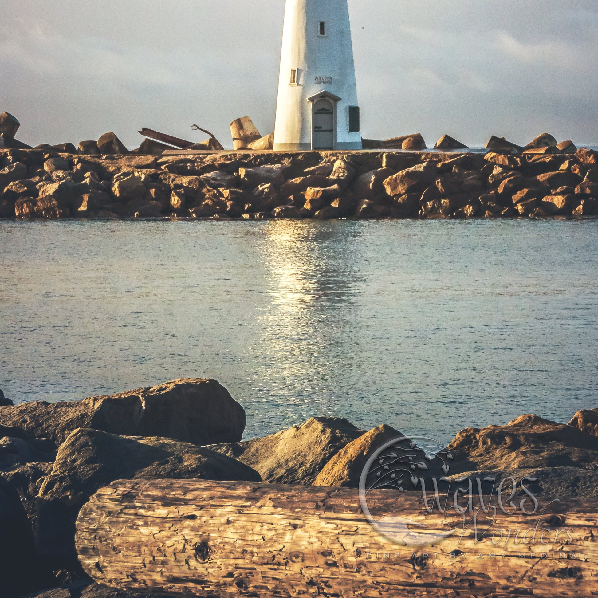 a light house sitting on top of a rocky shore