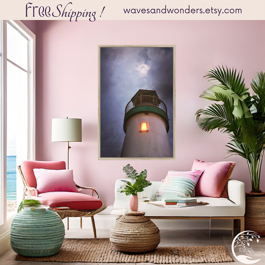 a living room with pink walls and a painting on the wall