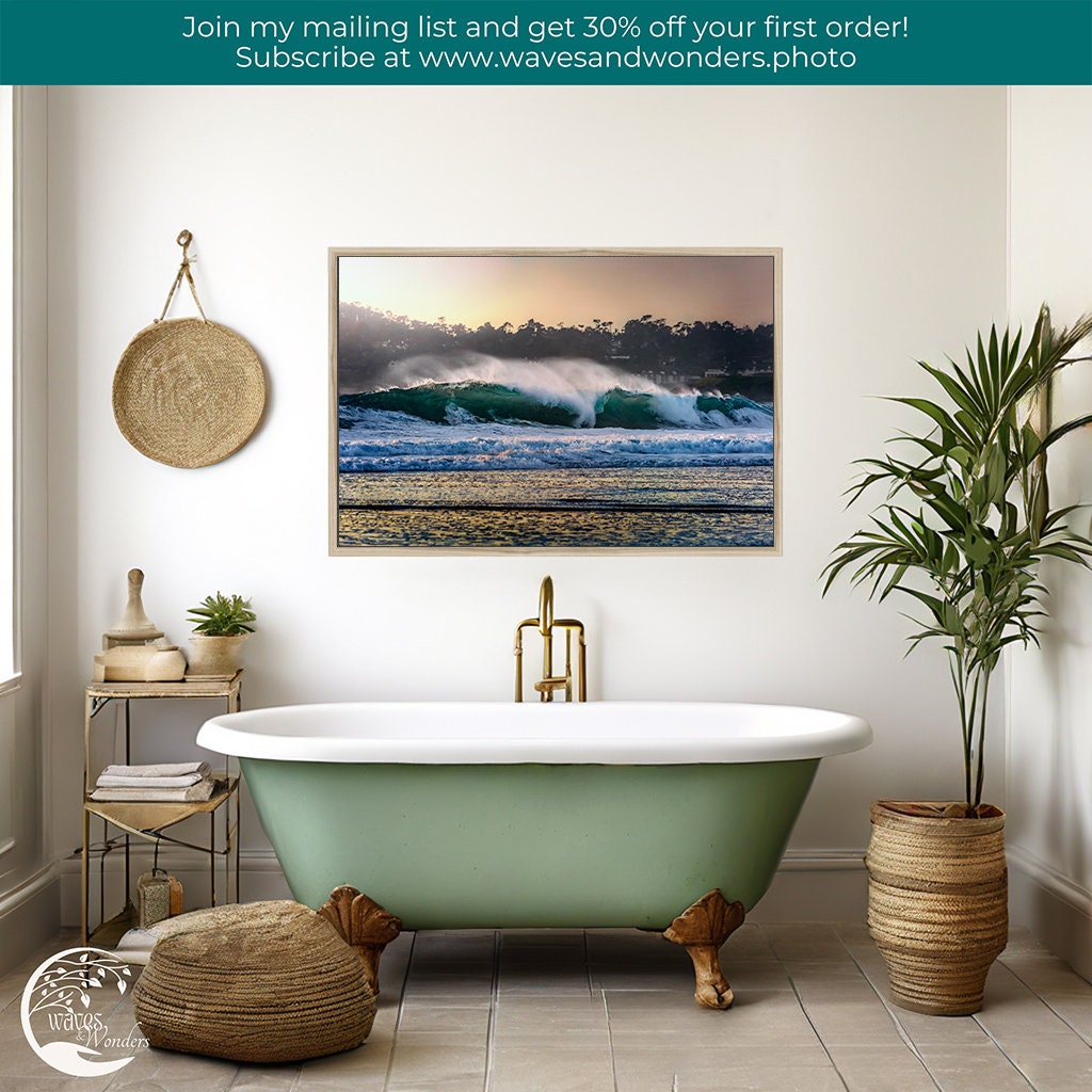 a bathroom with a tub and a painting on the wall