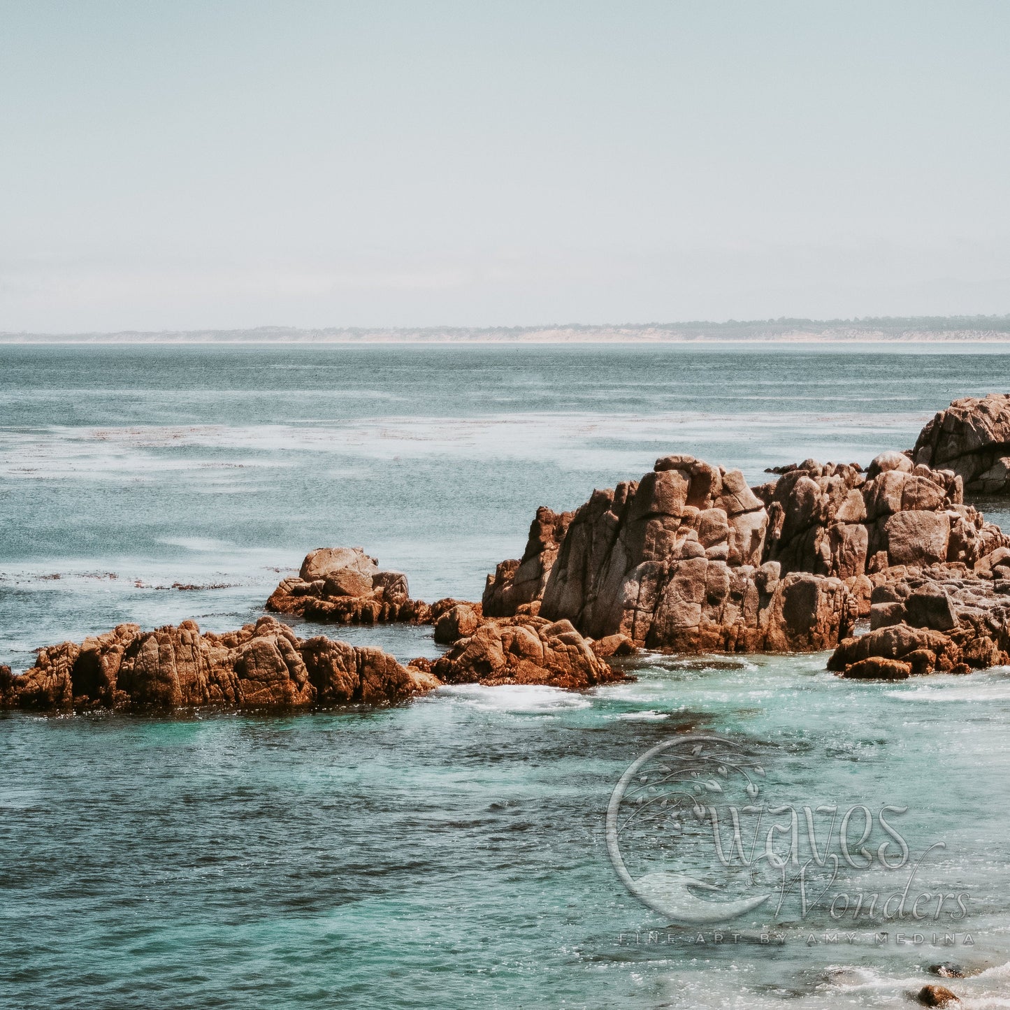 a large body of water surrounded by rocks