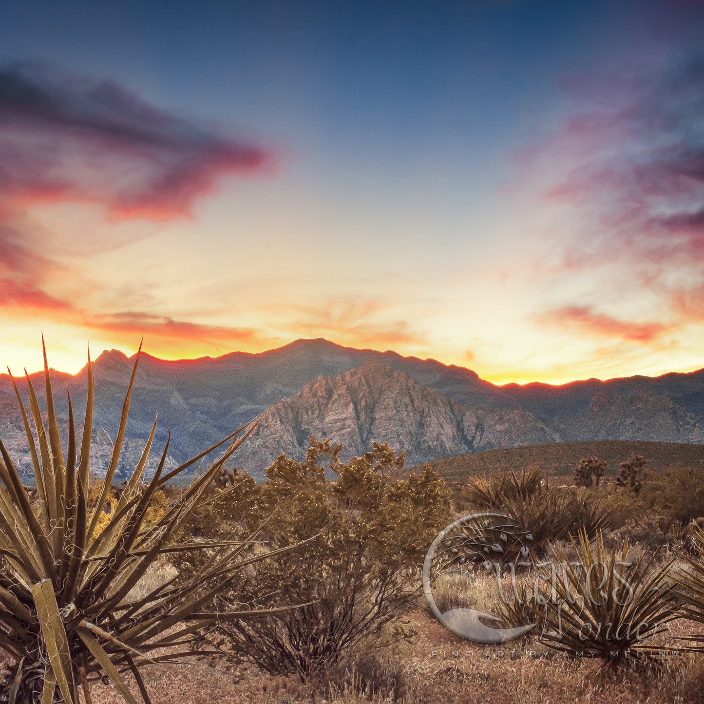 the sun is setting over a mountain range