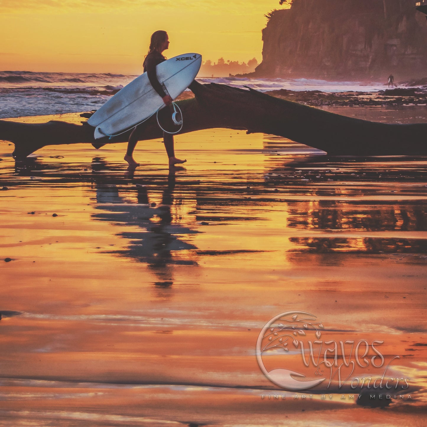 a woman holding a surfboard on top of a beach