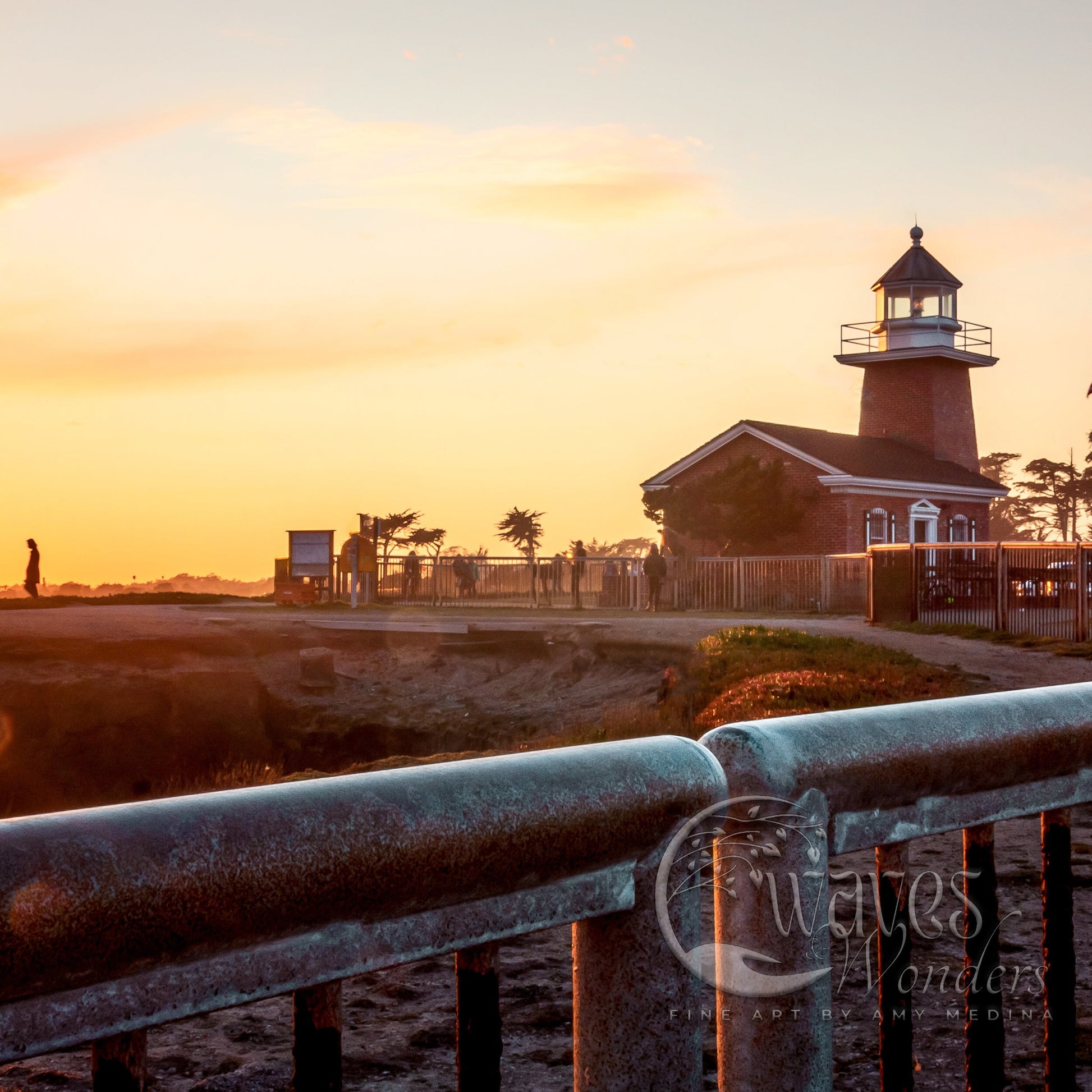 a light house sitting on top of a sandy beach