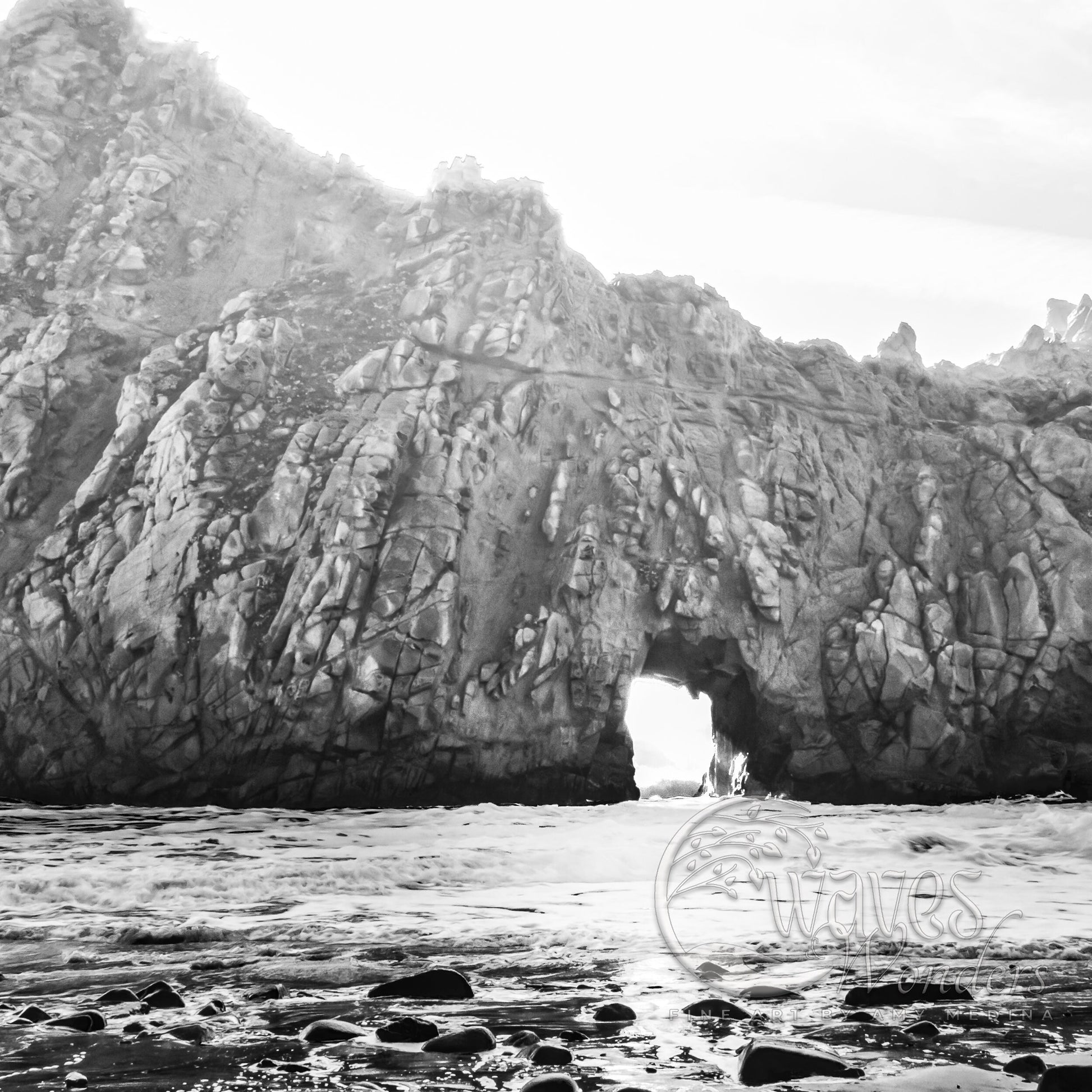 a black and white photo of a rock formation