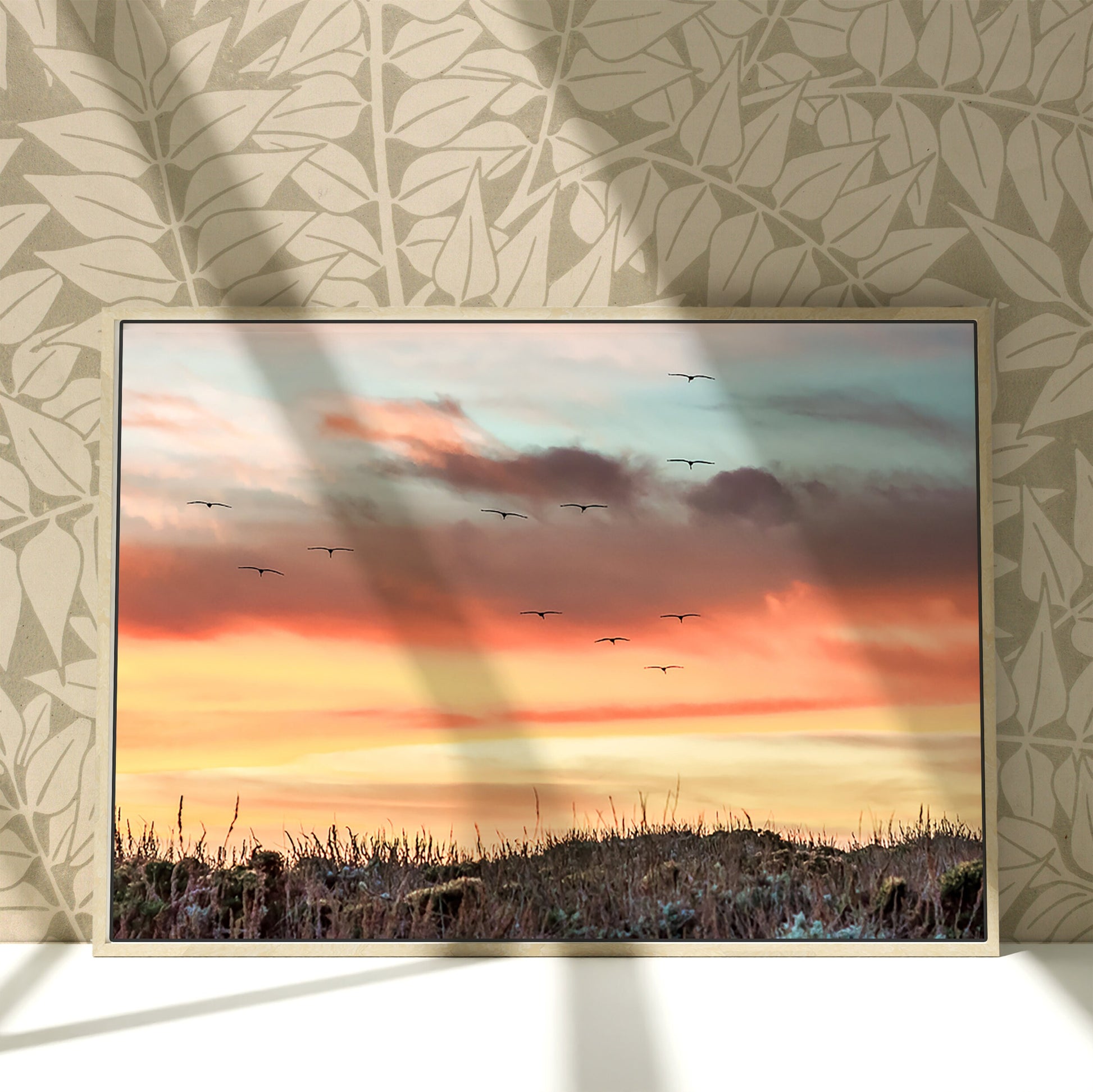 a painting of a sunset with birds flying in the sky