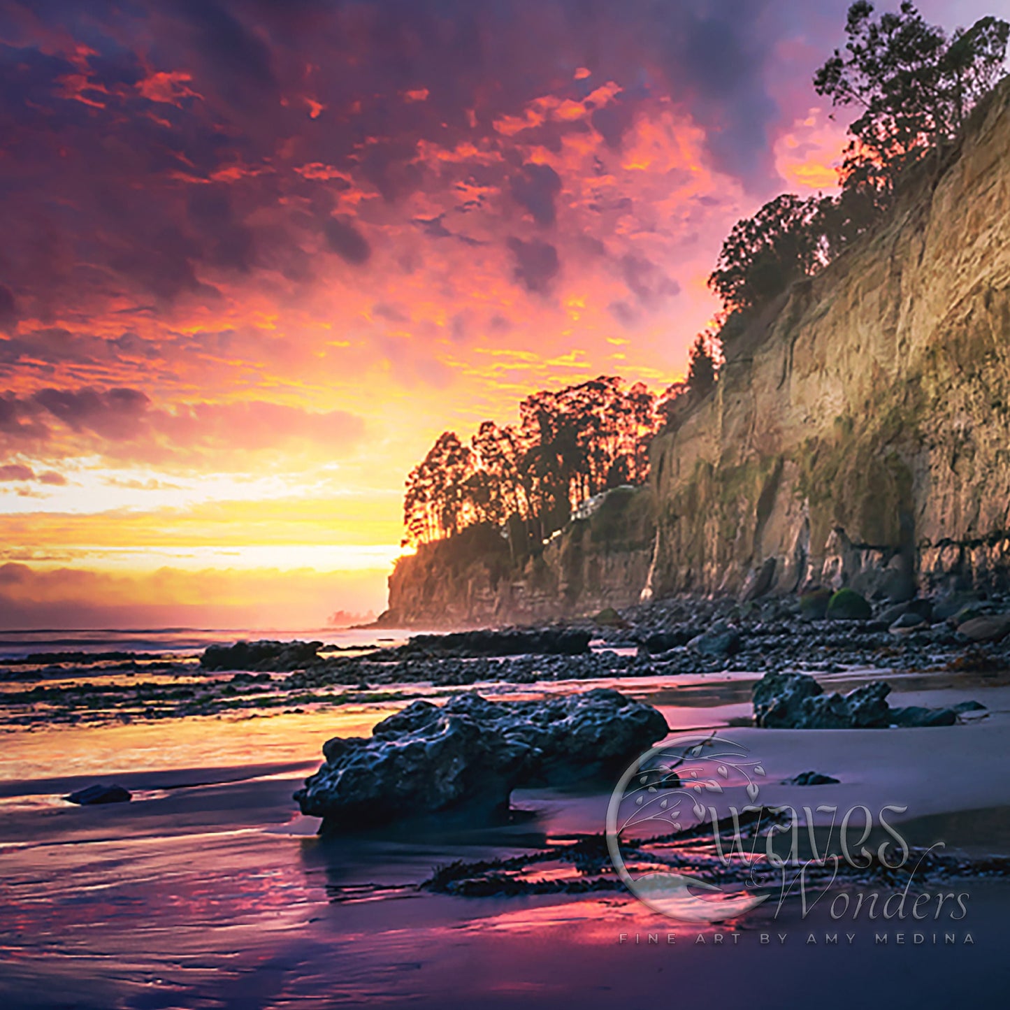 a beautiful sunset over the ocean with a rocky shoreline