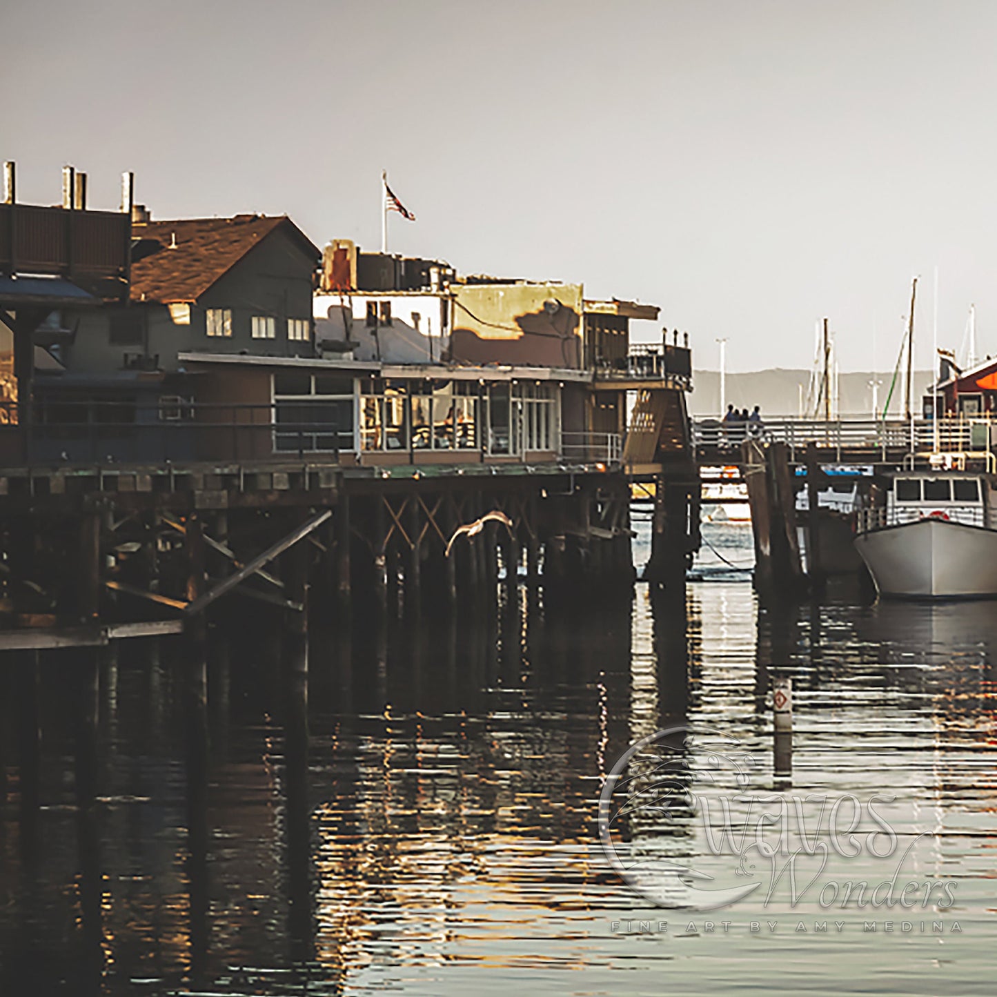 a boat is docked at a pier in the water