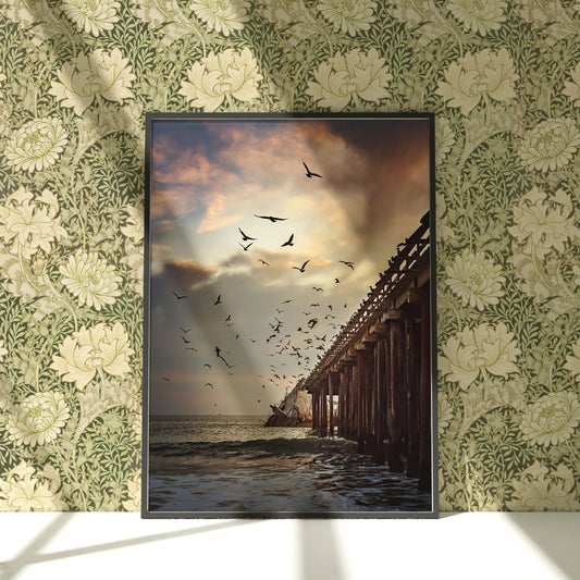 a picture of birds flying over a pier