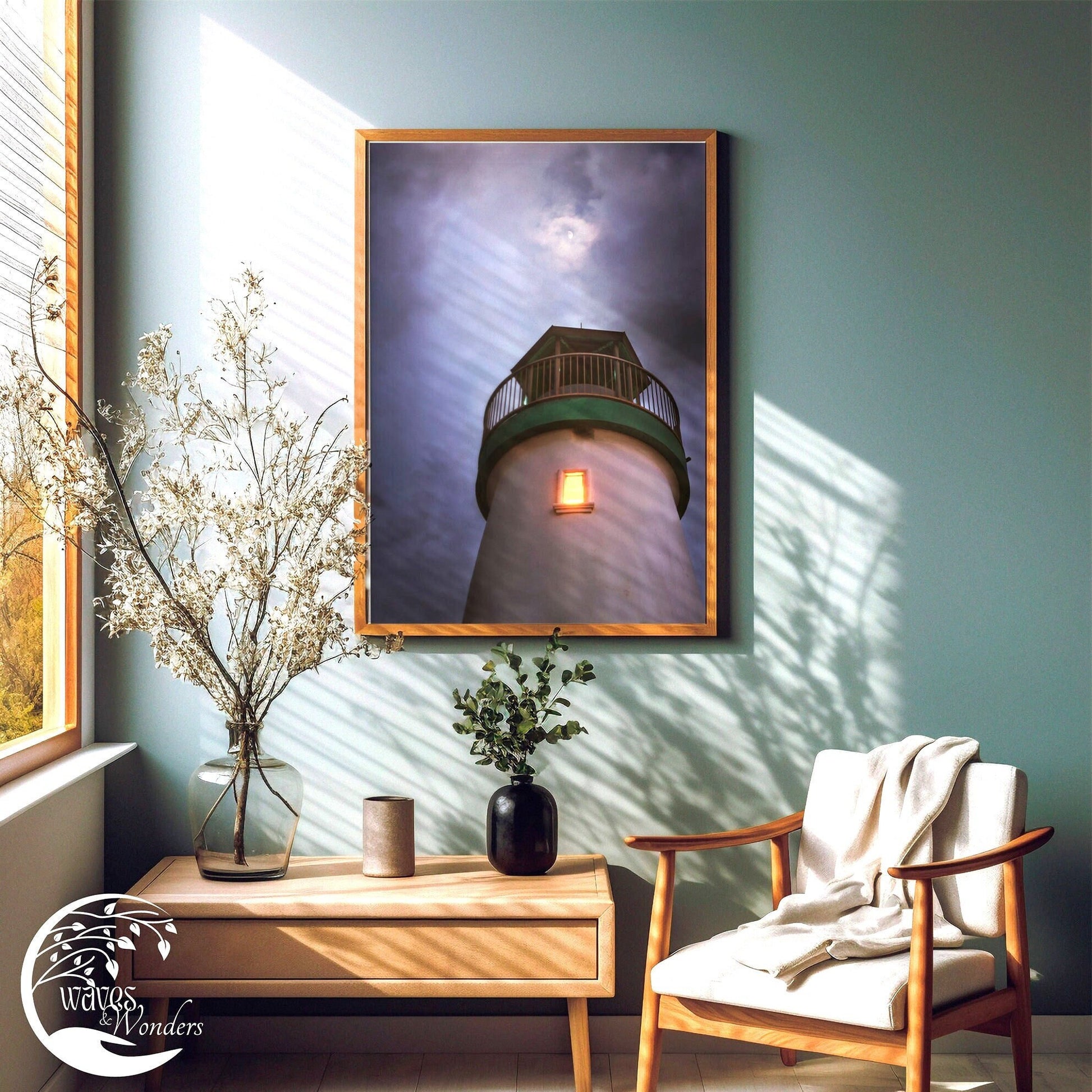 a painting of a light house is hanging on a wall