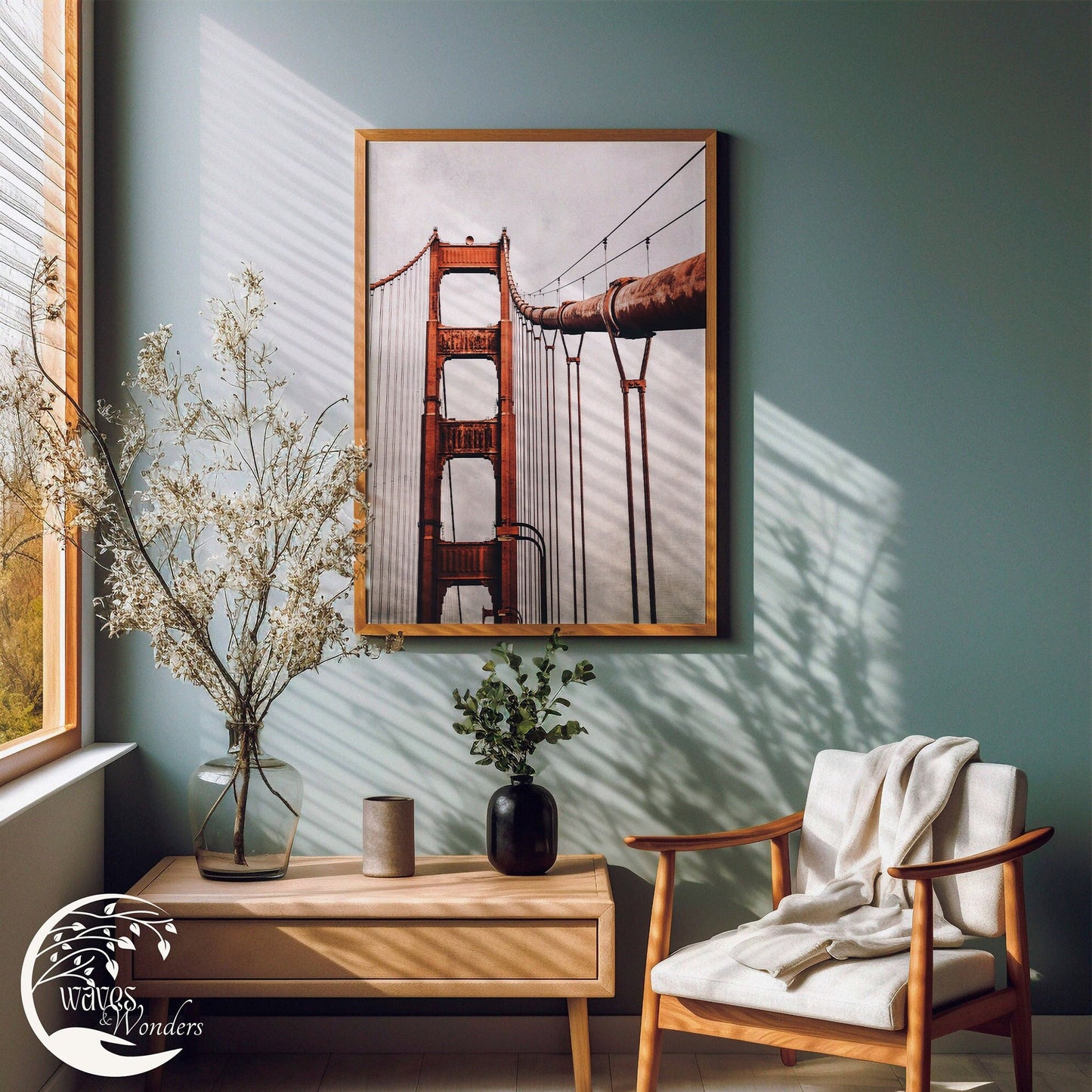 a picture of the golden gate bridge hanging on a wall